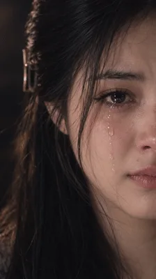 Young Woman Crying With Tears Rolling Down Her Face