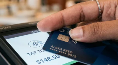 Customer Making Contactless Payment With Credit Card