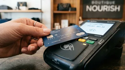 Customer Making Contactless Payment With Credit Card