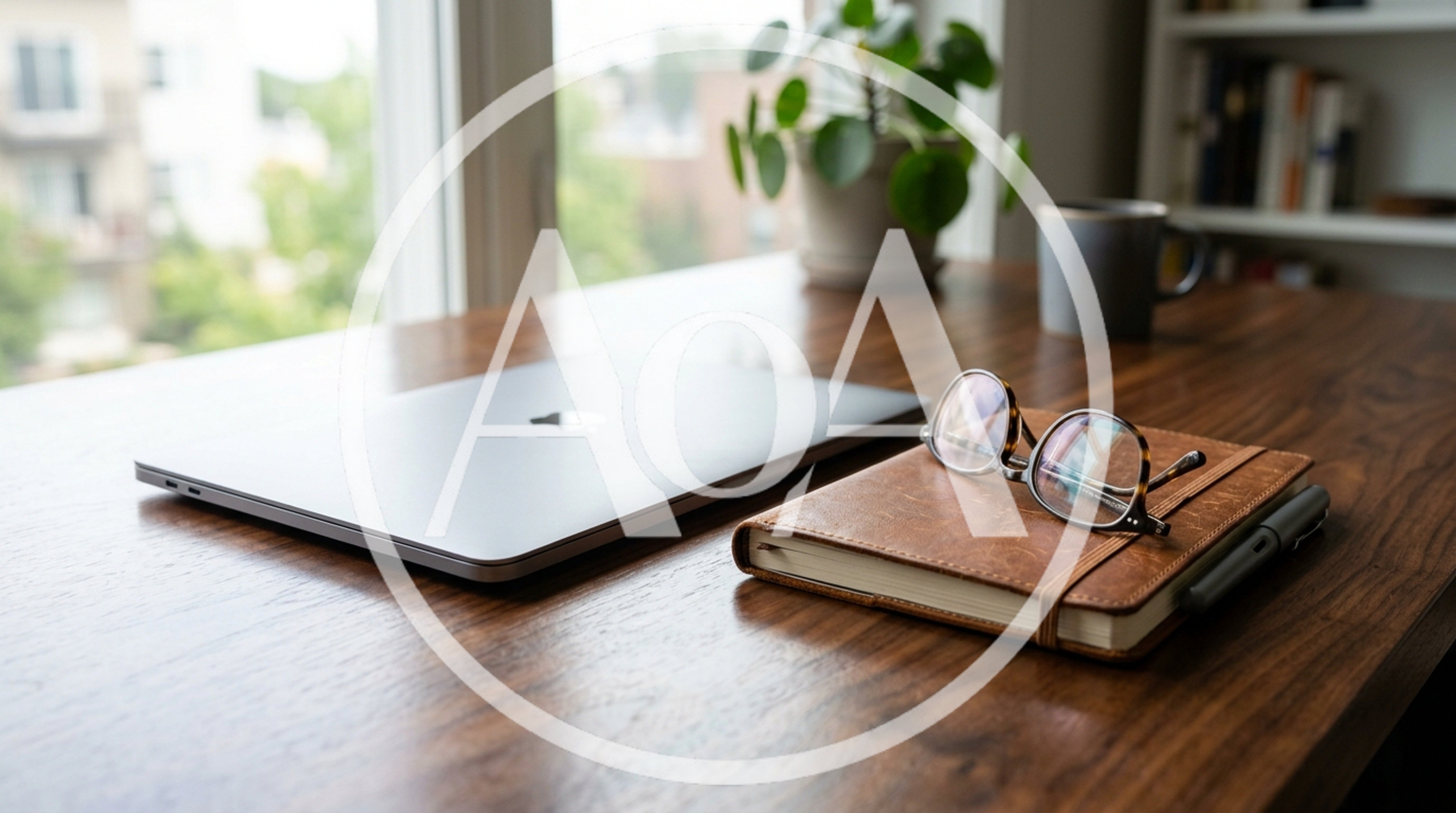 Laptop And Notebook On A Wooden Desk