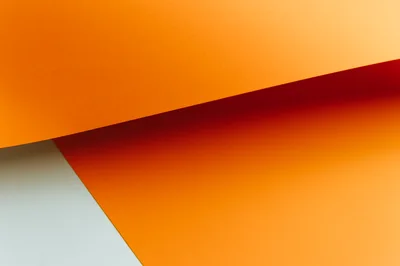 Abstract Geometric Composition Of Orange And White Paper