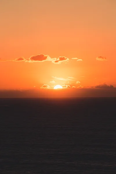 Golden Sunset Over The Calm Ocean Horizon