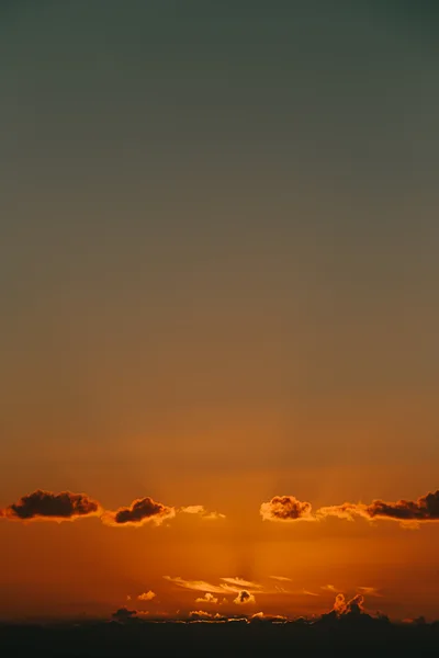 Golden Sunset Sky With Scattered Clouds