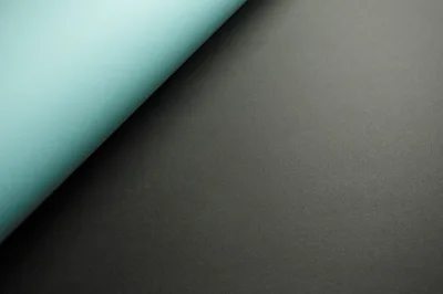 Abstract Background With Light Blue And Dark Gray Paper