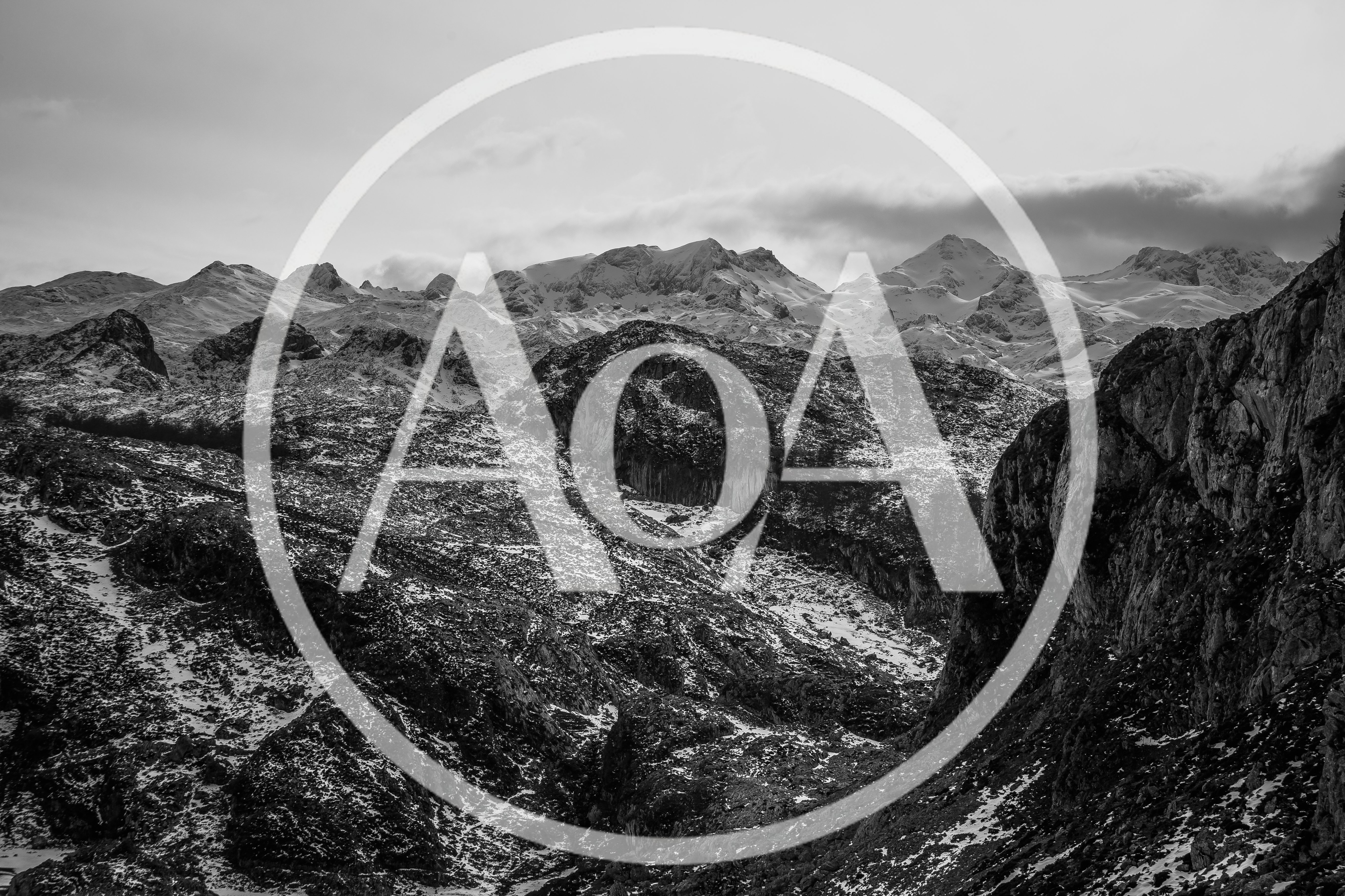 Rugged Mountain Range With Snow Covered Peaks