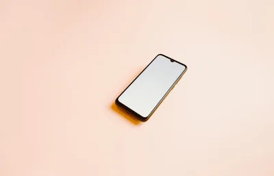 Modern Smartphone With Blank Screen On Pastel Background