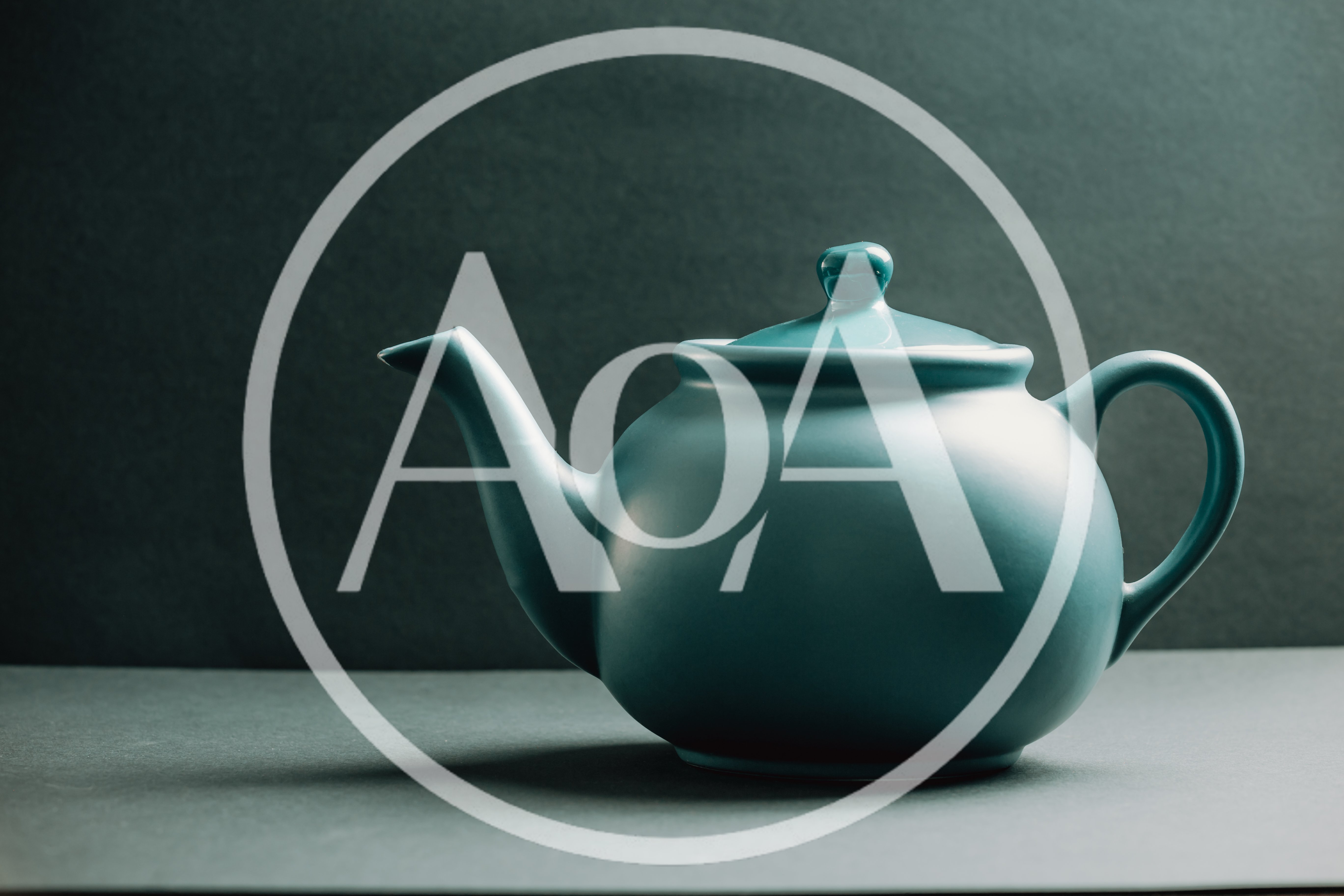 Teal Ceramic Teapot on Dark Background