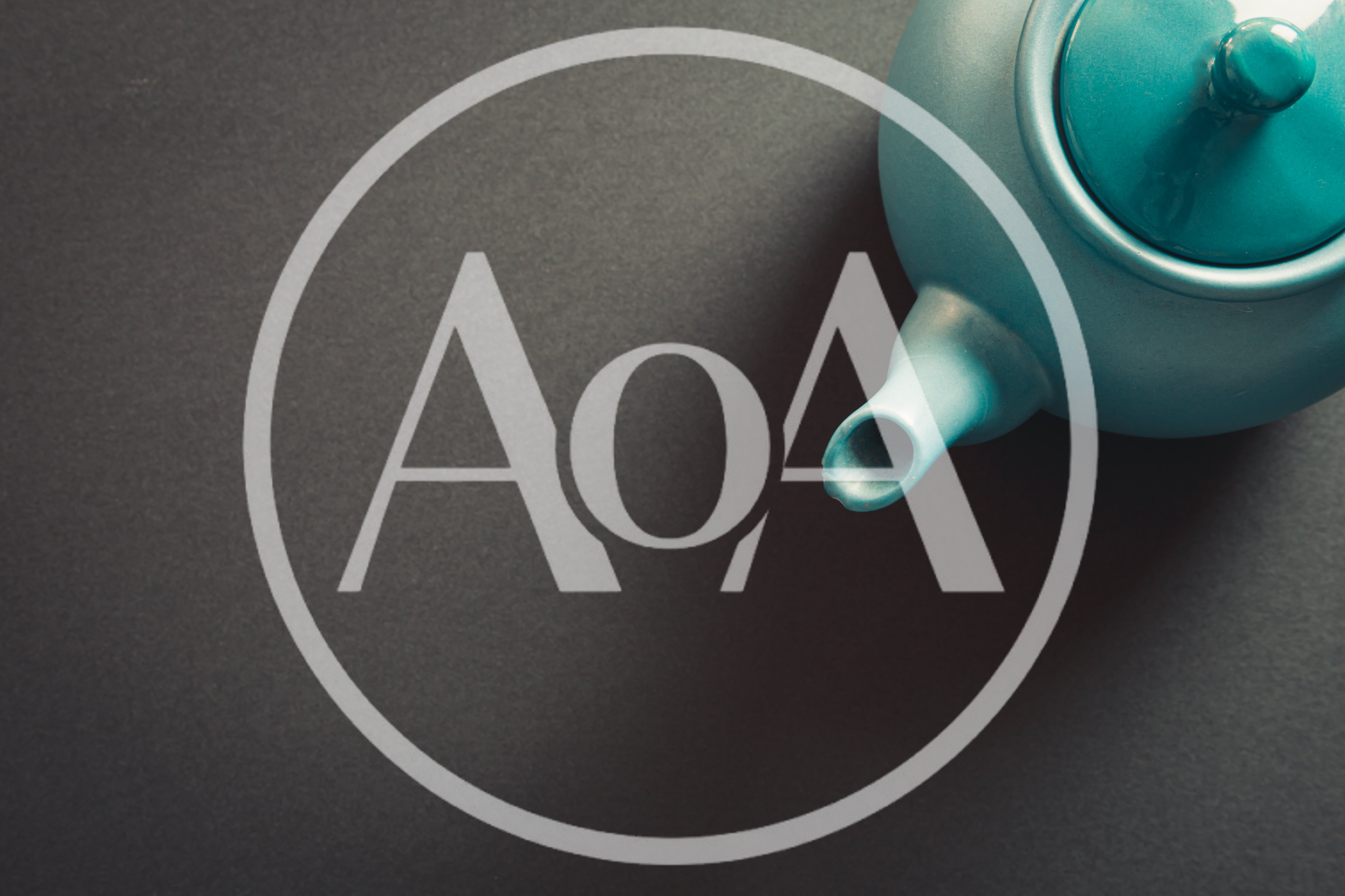 Teal Ceramic Teapot on Dark Grey Background