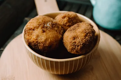 Fried Arancini Rice Balls In A Ceramic Bowl