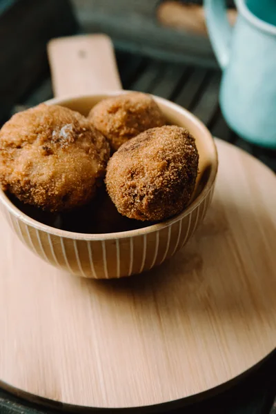 Fried Meatballs In A Striped Ceramic Bowl
