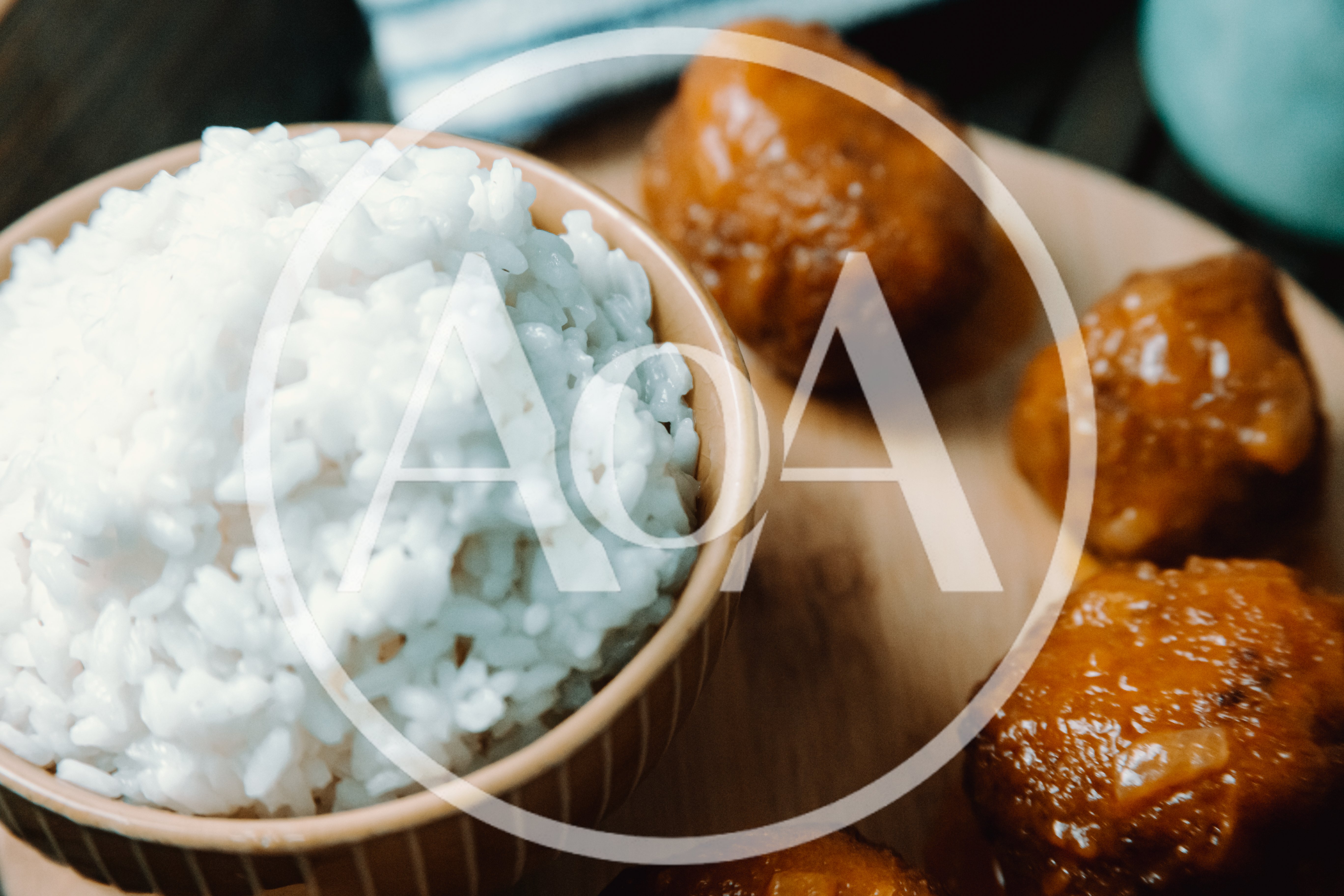 Bowl Of White Rice With Glazed Meatballs