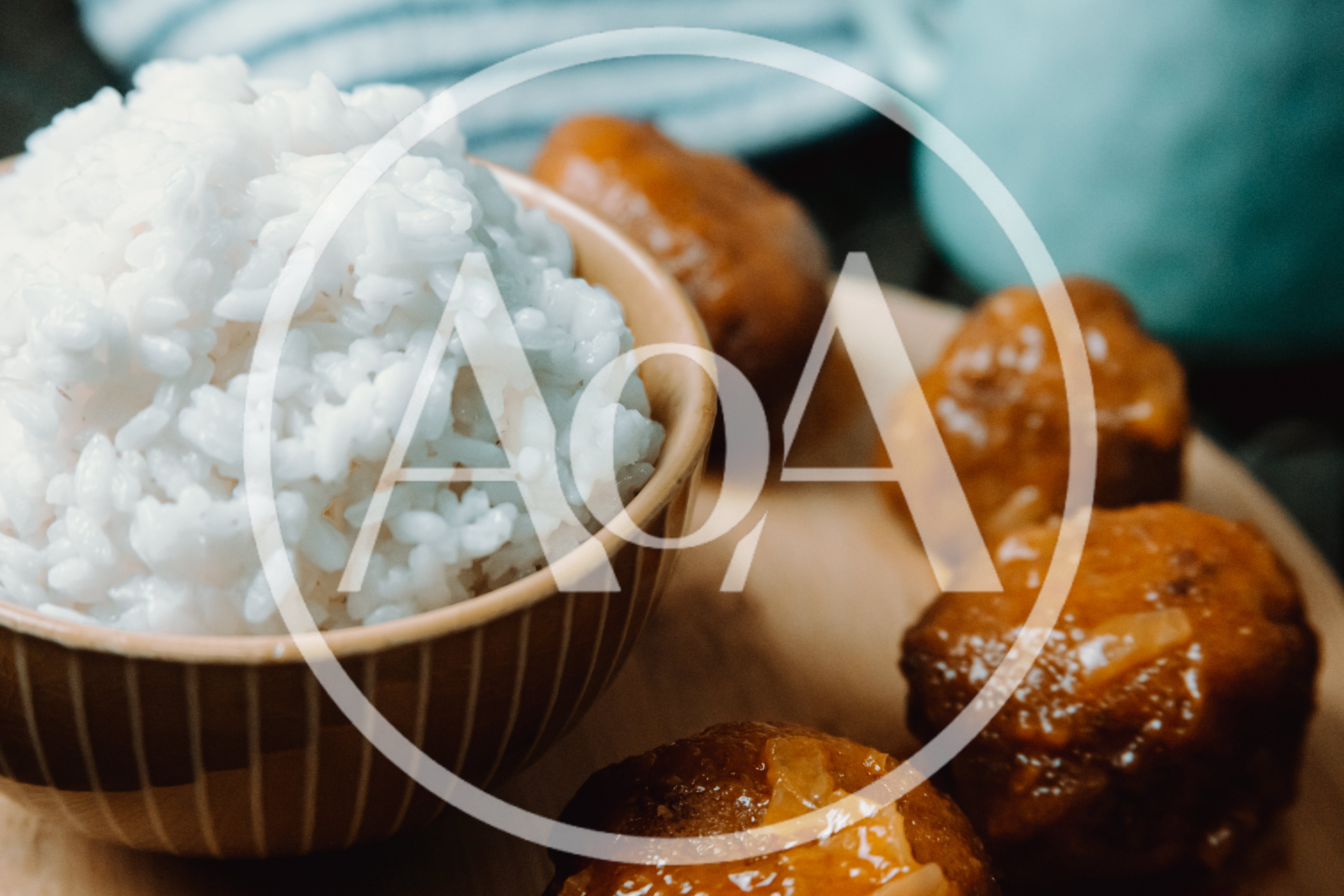 Bowl Of White Rice With Glazed Meatballs