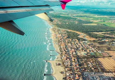 Aerial View Of Coastal Town From Airplane Window