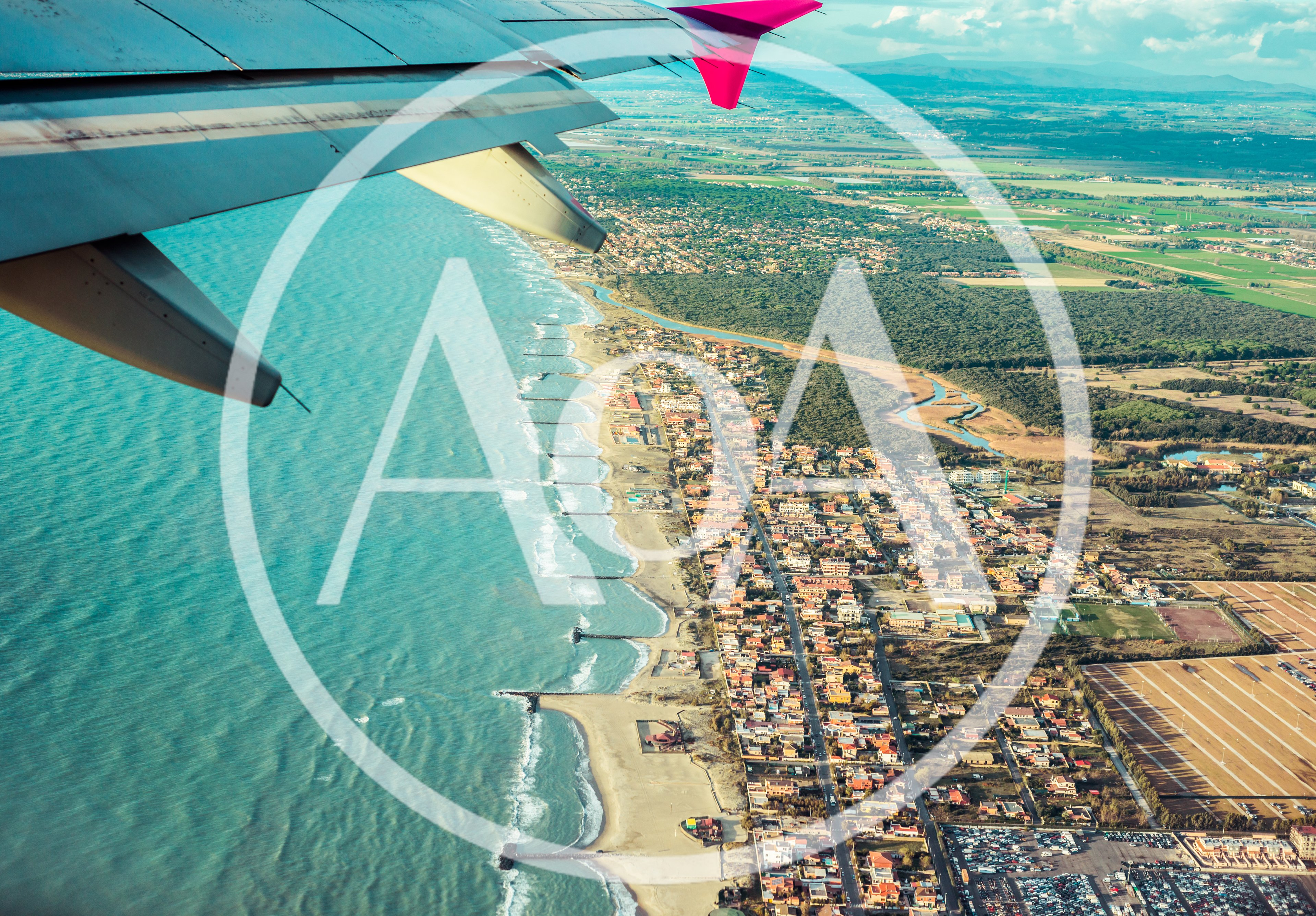 Aerial View Of Coastal Town From Airplane Window