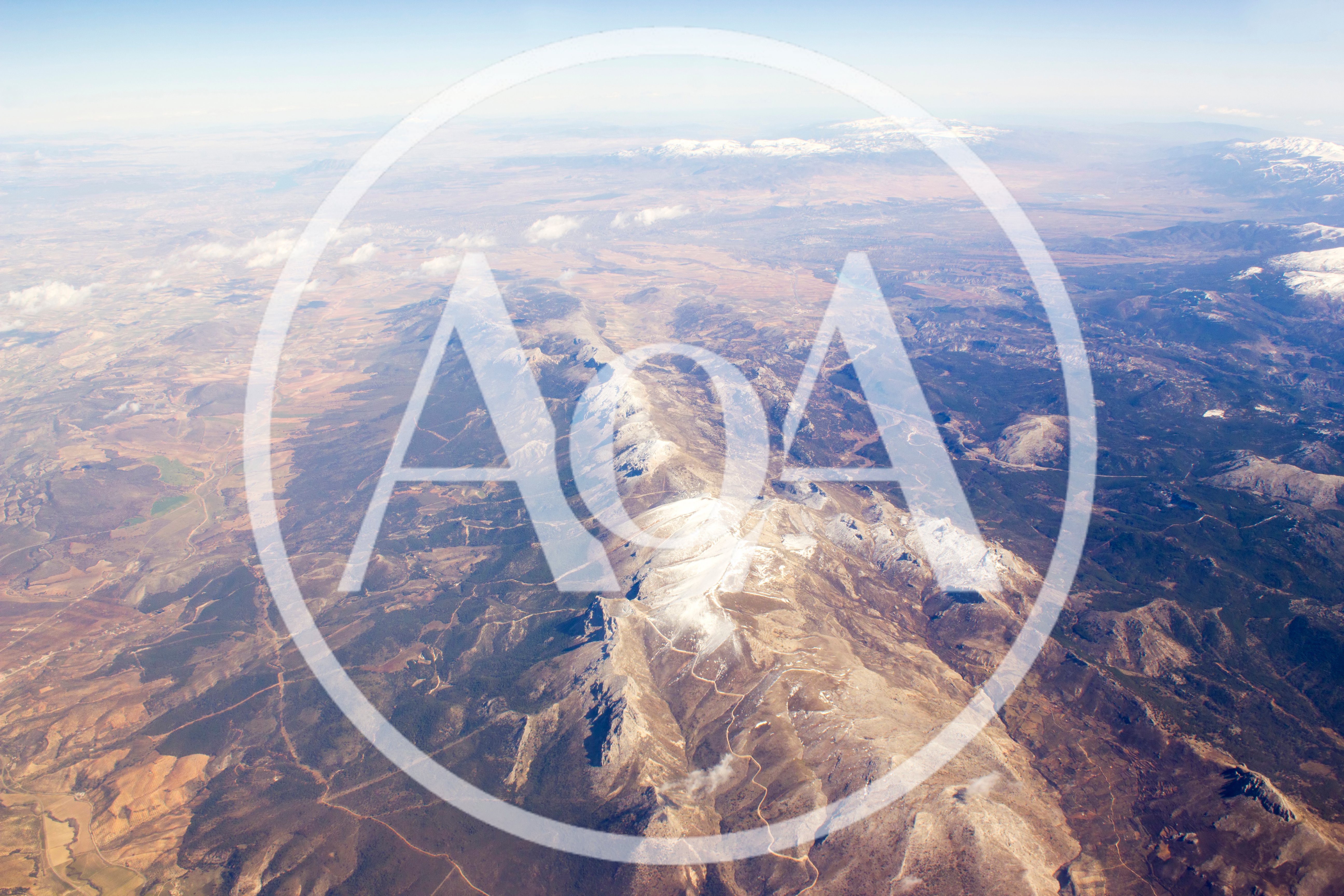 Aerial View Of Snow Capped Mountain Range