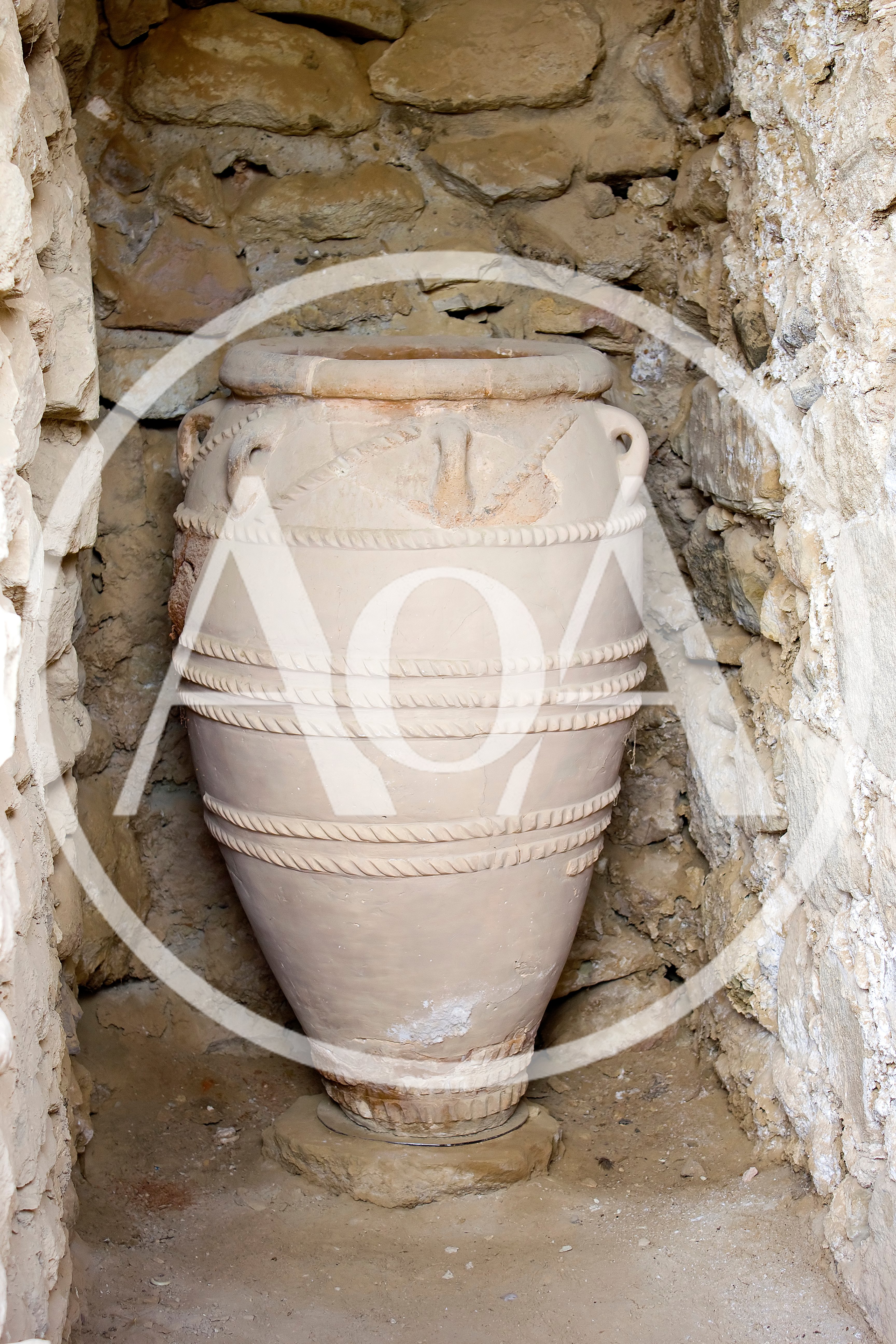 Ancient Minoan Pithos Storage Jar In Stone Alcove