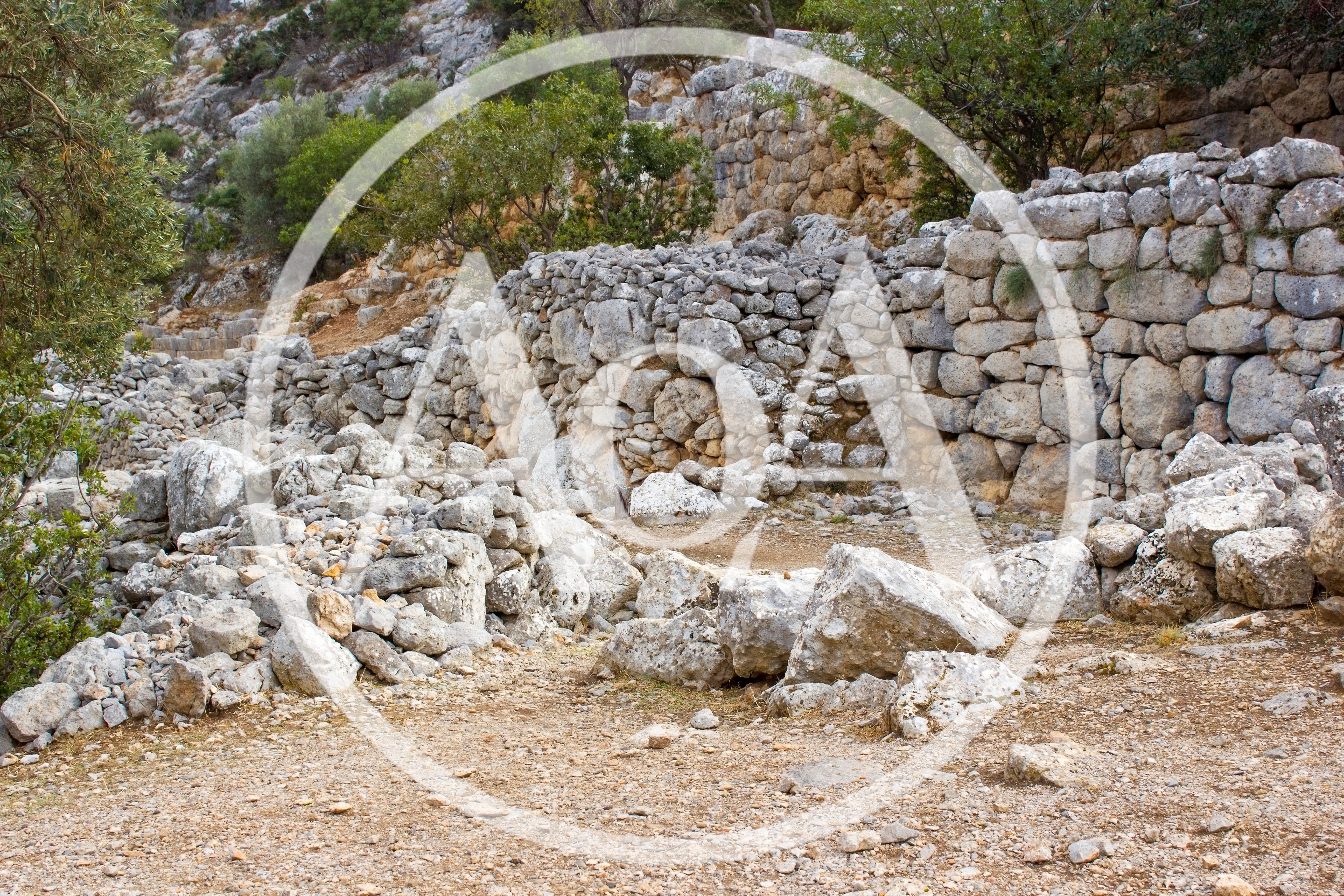 Ancient Stone Ruins In A Mediterranean Landscape