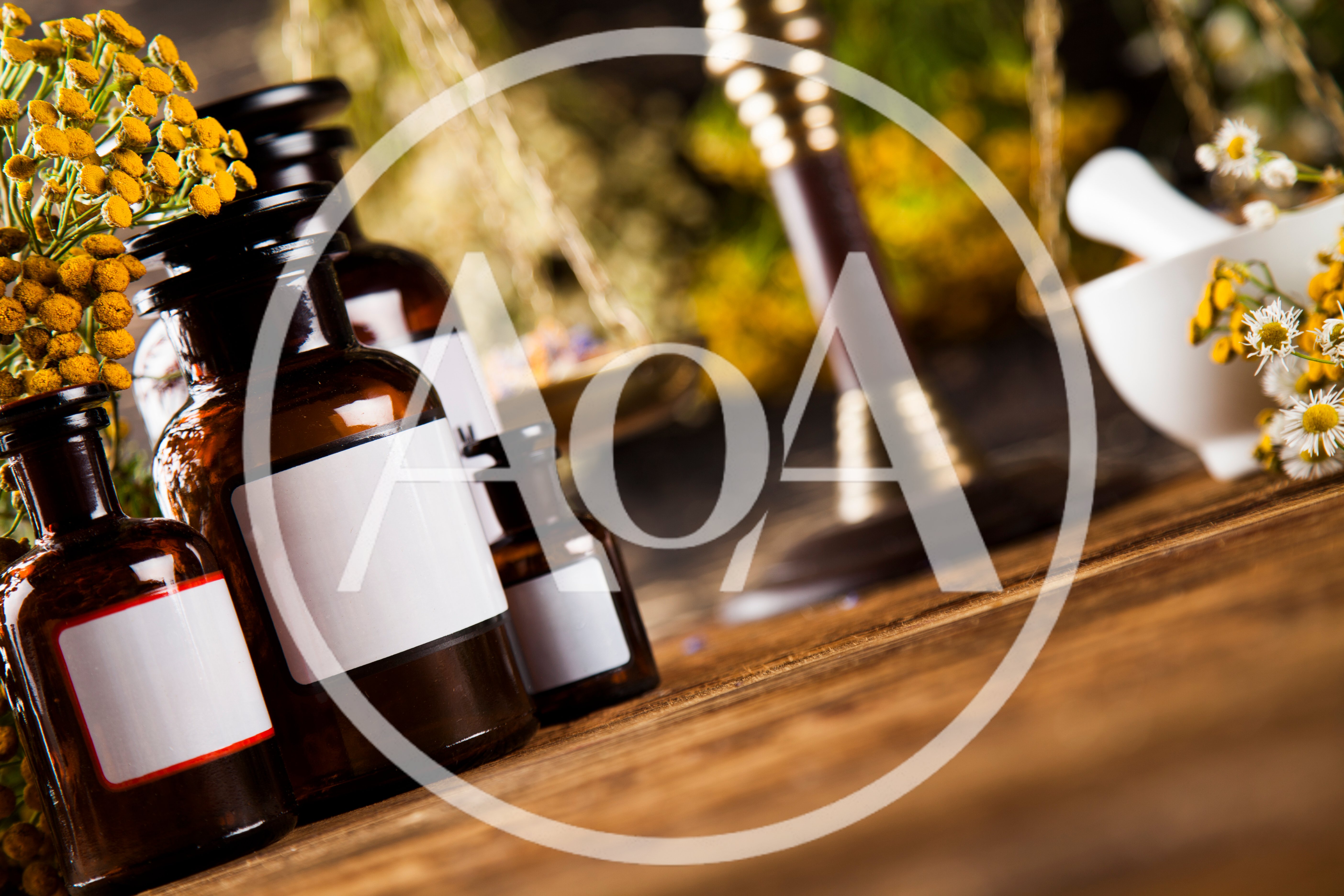 Apothecary Bottles With Herbs And Mortar On Wooden Table