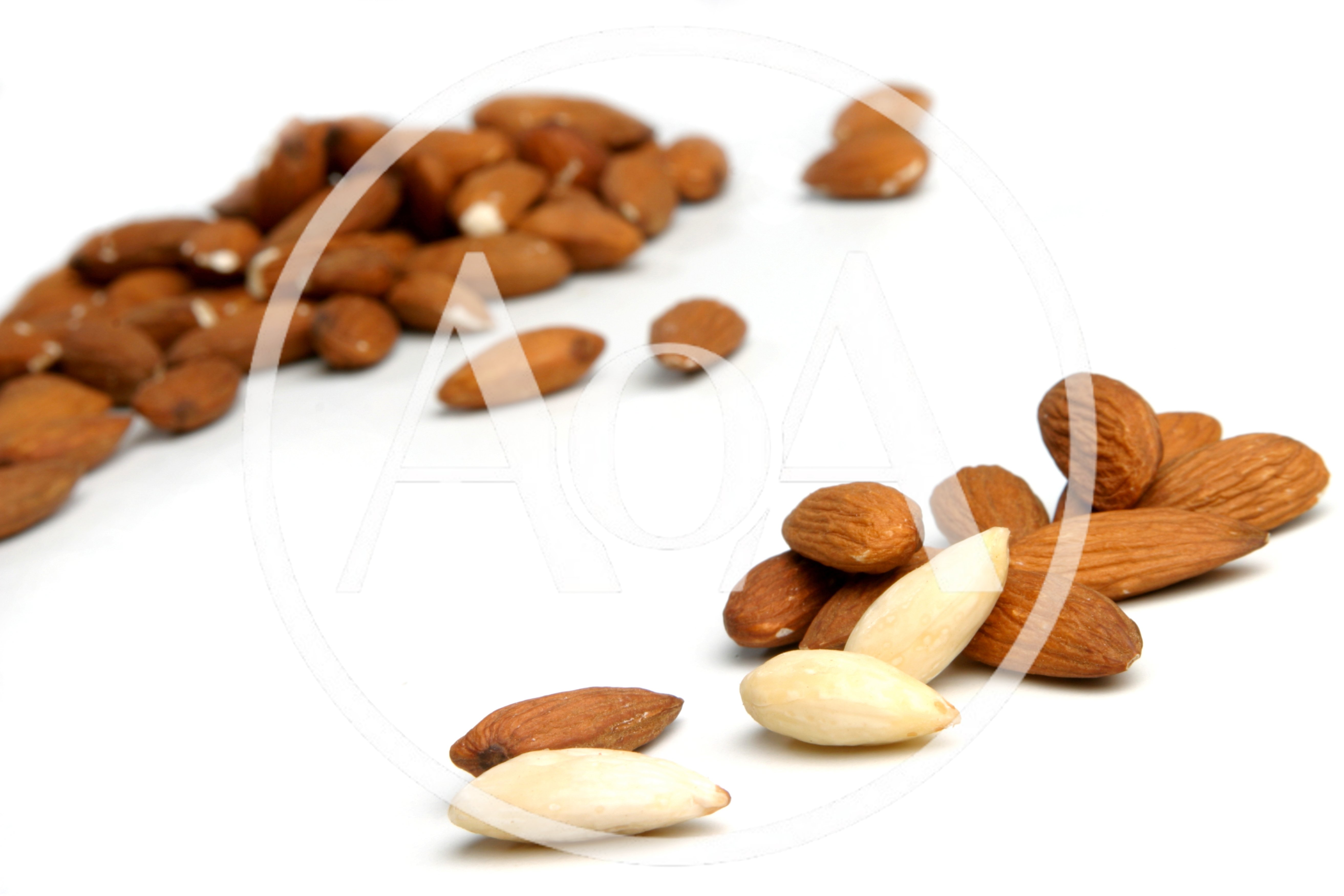 Raw Almonds And Blanched Almonds On White Background