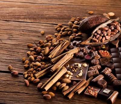 Assorted Chocolates and Nuts on Rustic Wooden Table