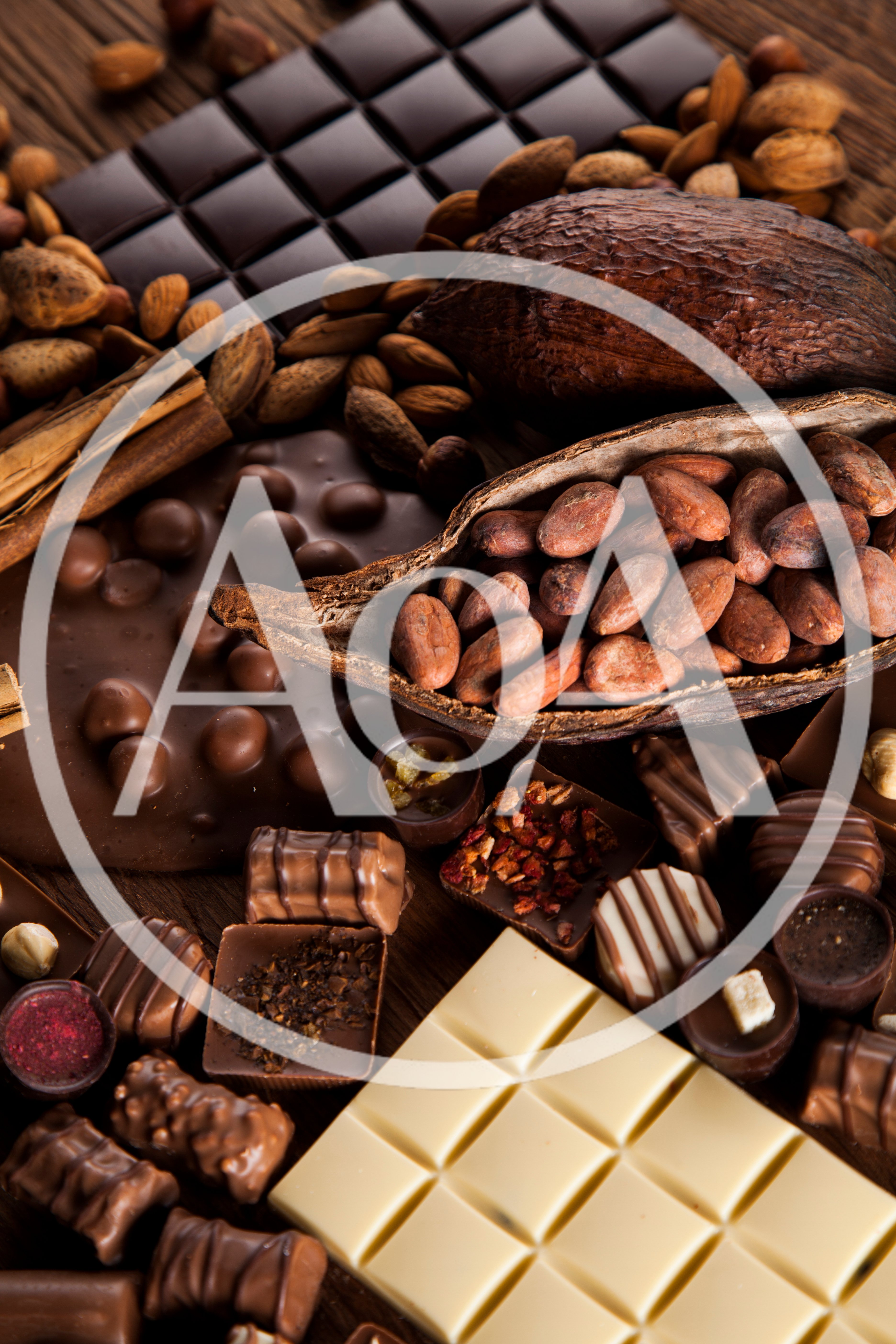 Assorted Chocolate Bars and Cocoa Beans on Wooden Table