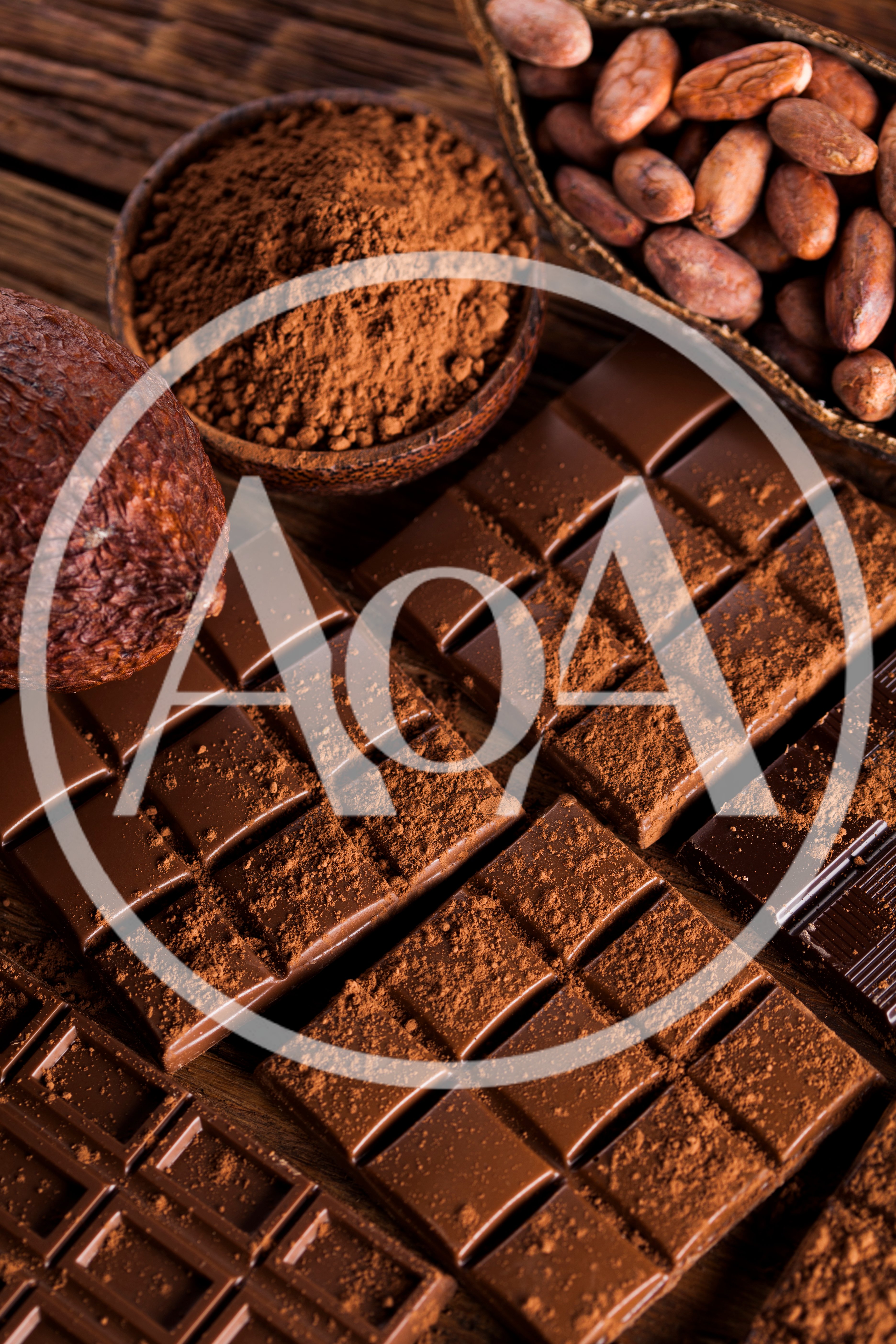 Dark Chocolate Bars and Cocoa Beans on Wooden Table