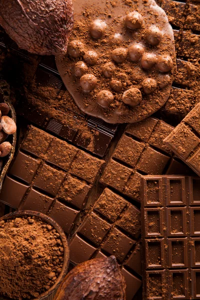 Assorted Chocolate Bars and Cocoa Powder Composition