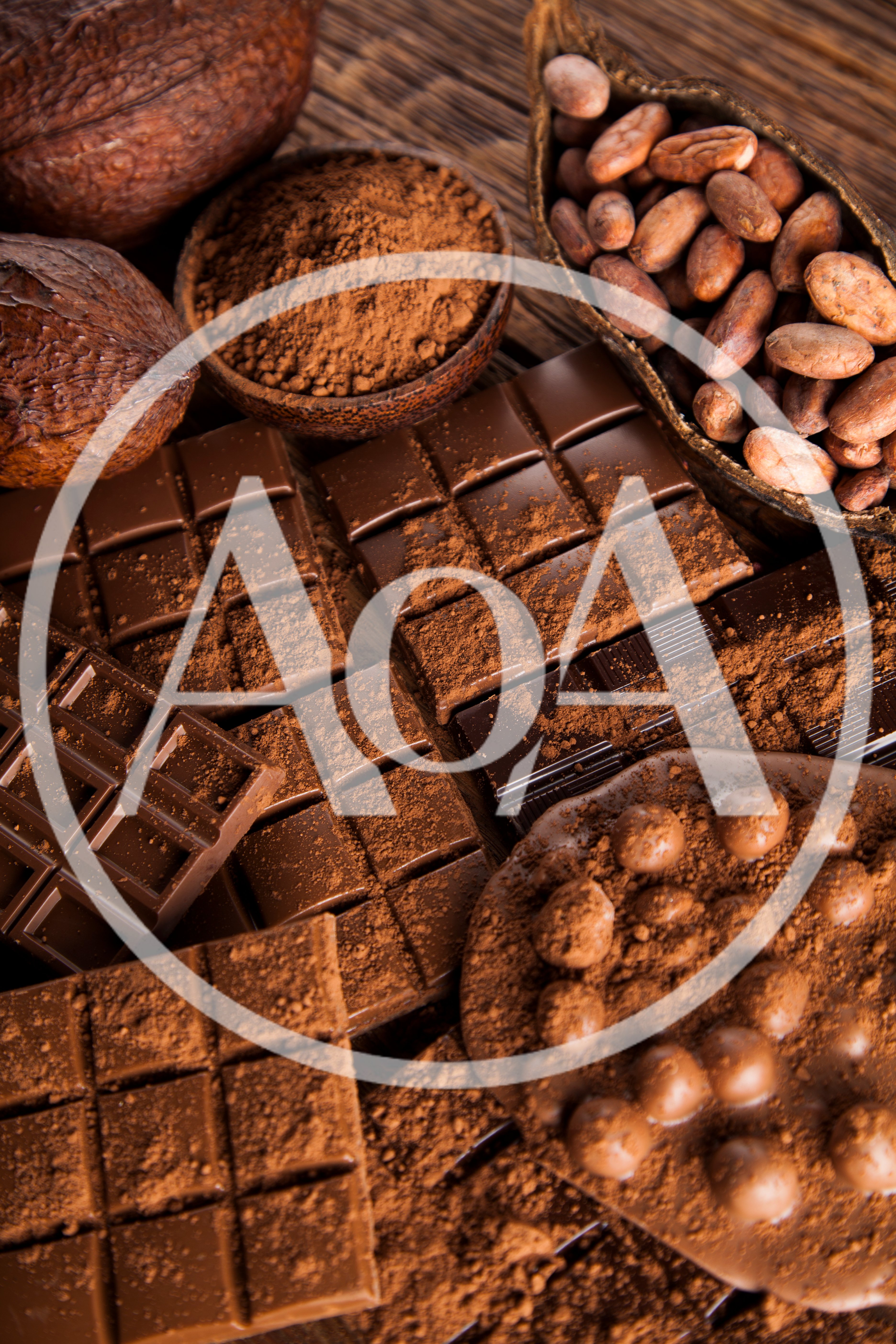 Assorted Chocolate Bars and Cocoa Beans on Wooden Table