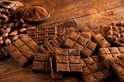 Assorted Dark Chocolate Bars And Cocoa Beans