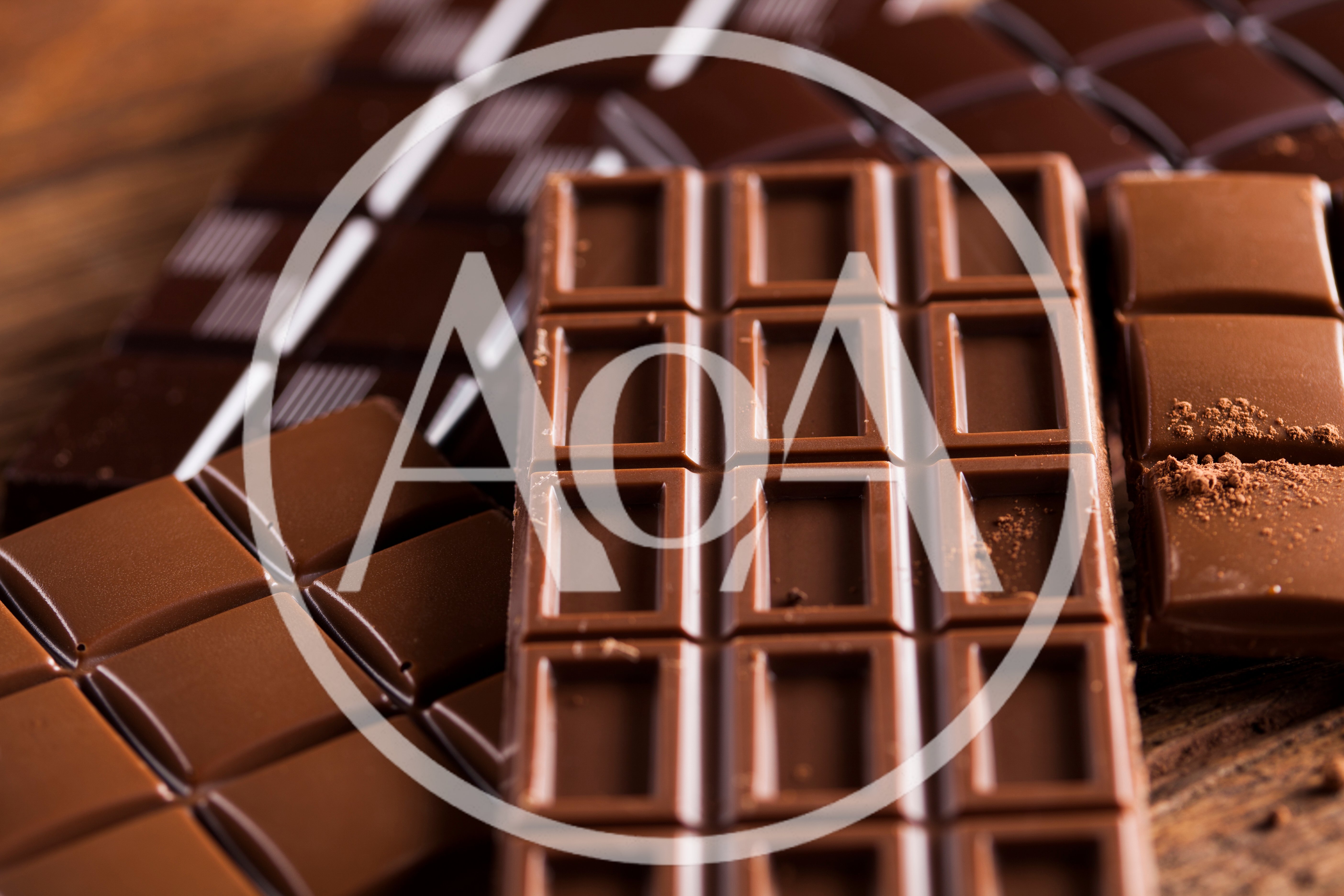 Assorted Milk and Dark Chocolate Bars on Wooden Surface