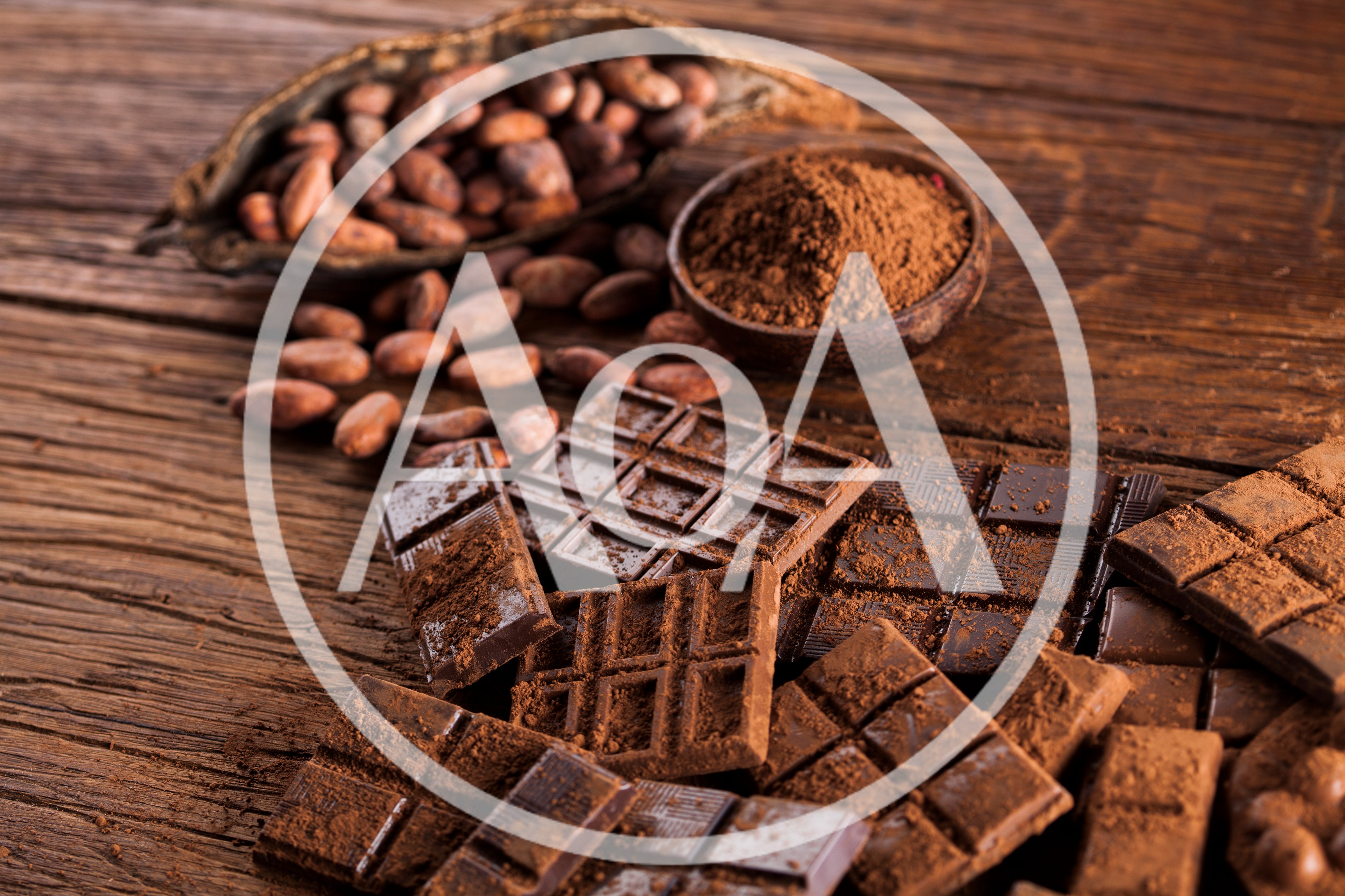 Dark Chocolate Bars and Cocoa Beans on Wooden Table