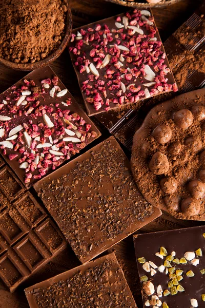 Assorted Gourmet Chocolate Bars With Toppings And Cocoa Powder