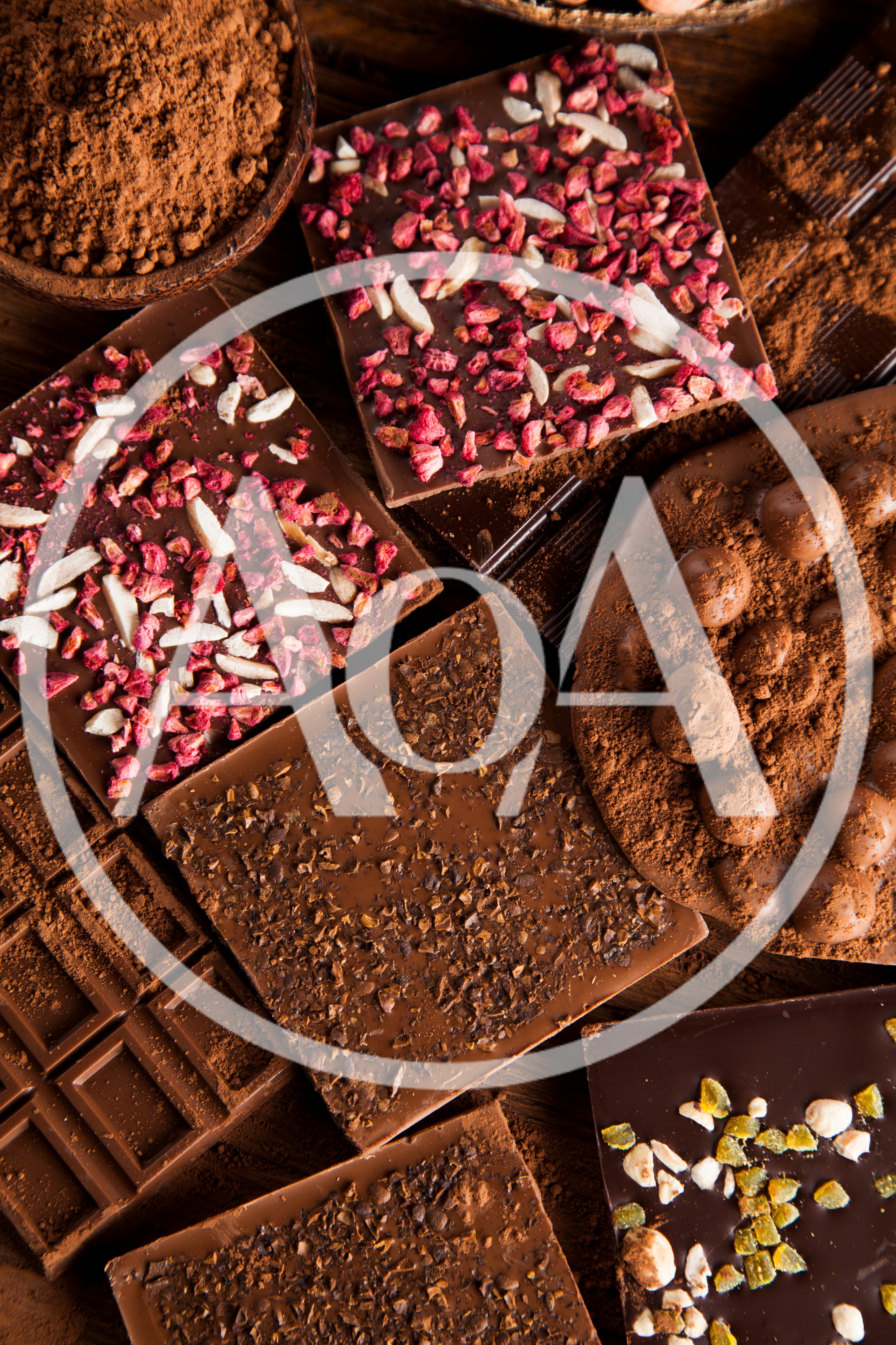Assorted Gourmet Chocolate Bars With Toppings And Cocoa Powder