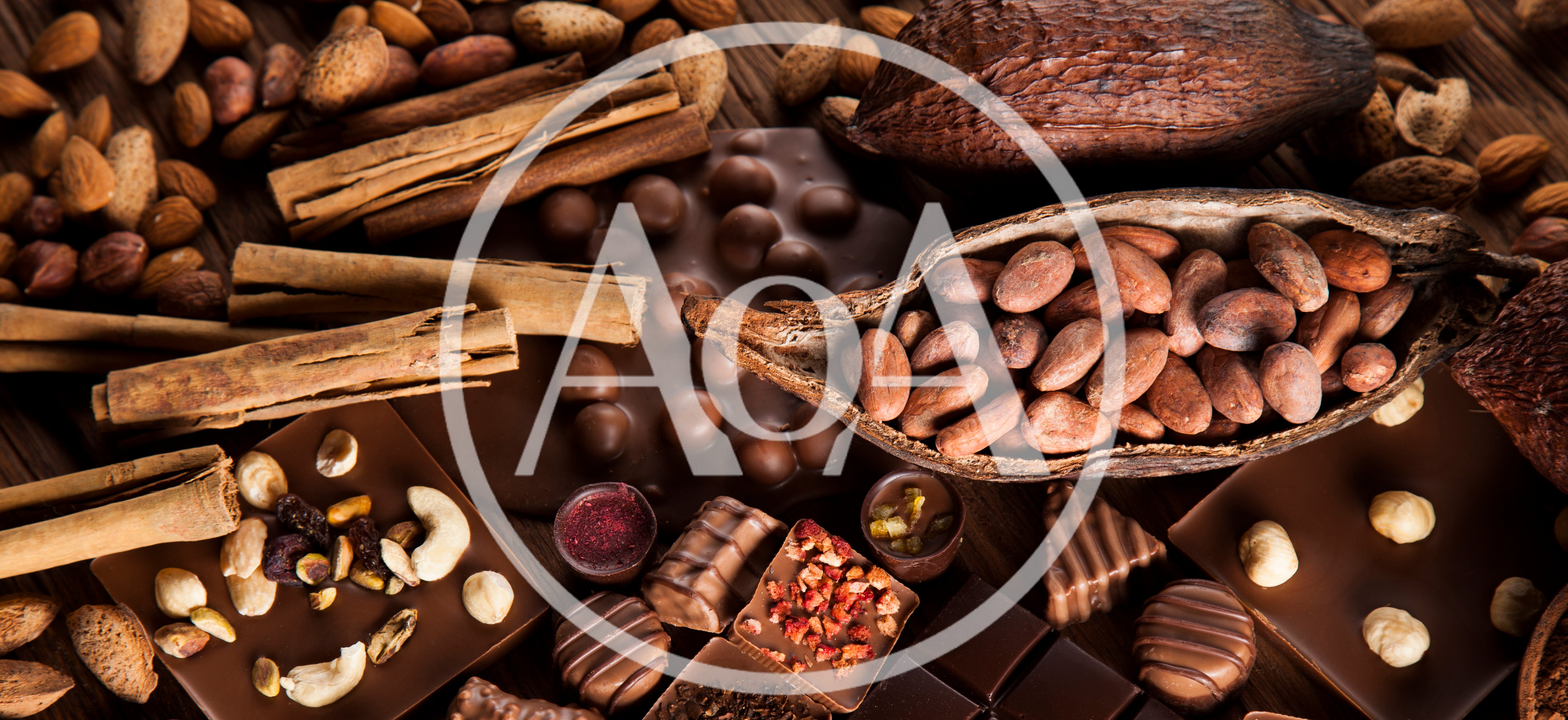 Assorted Chocolate Bars and Cocoa Beans on Wooden Table
