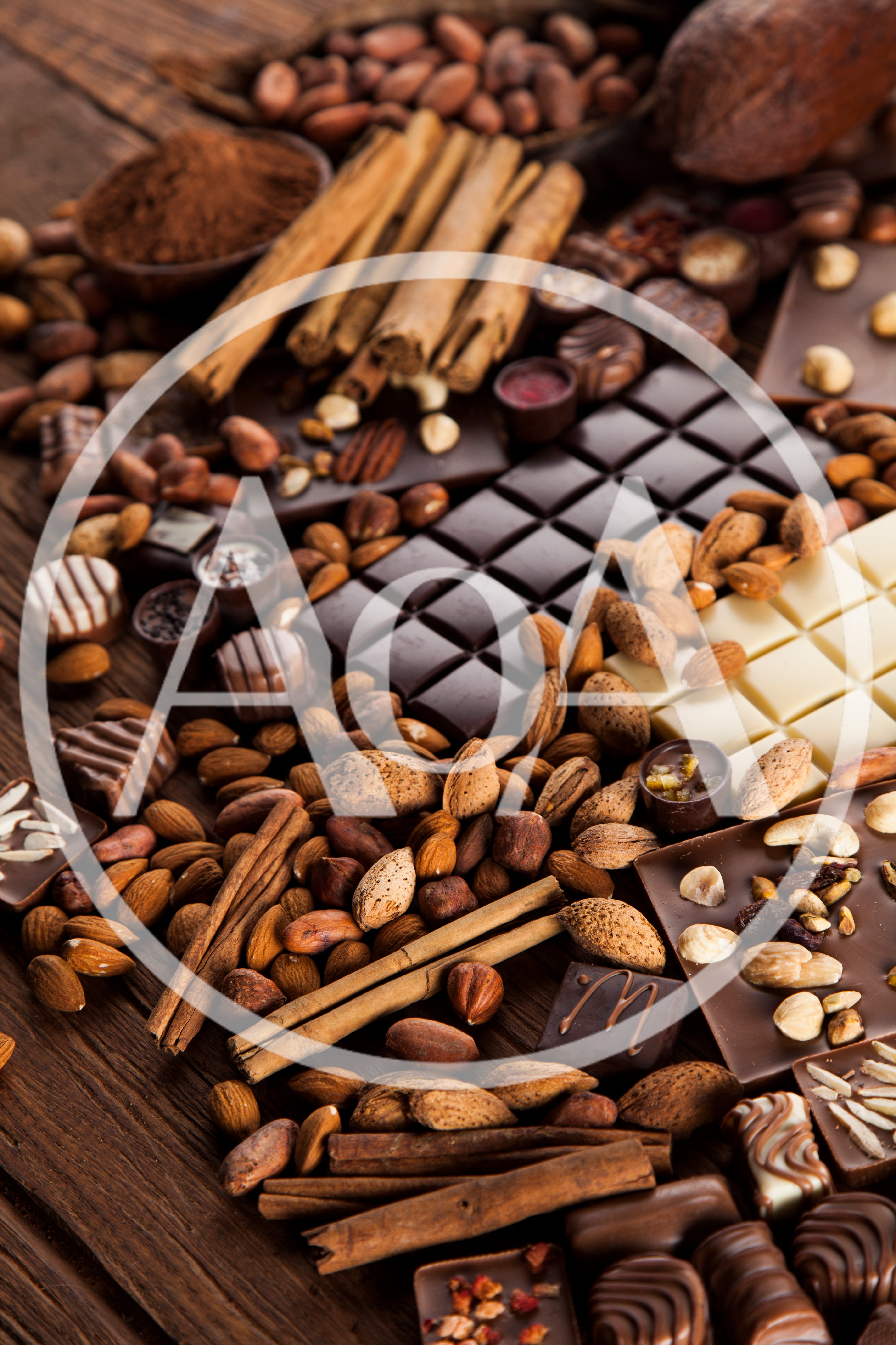 Assorted Chocolate Bars With Nuts And Cinnamon Sticks
