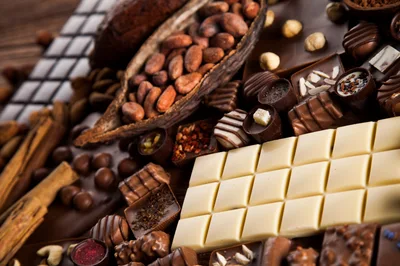 Assorted Gourmet Chocolates and Cocoa Beans