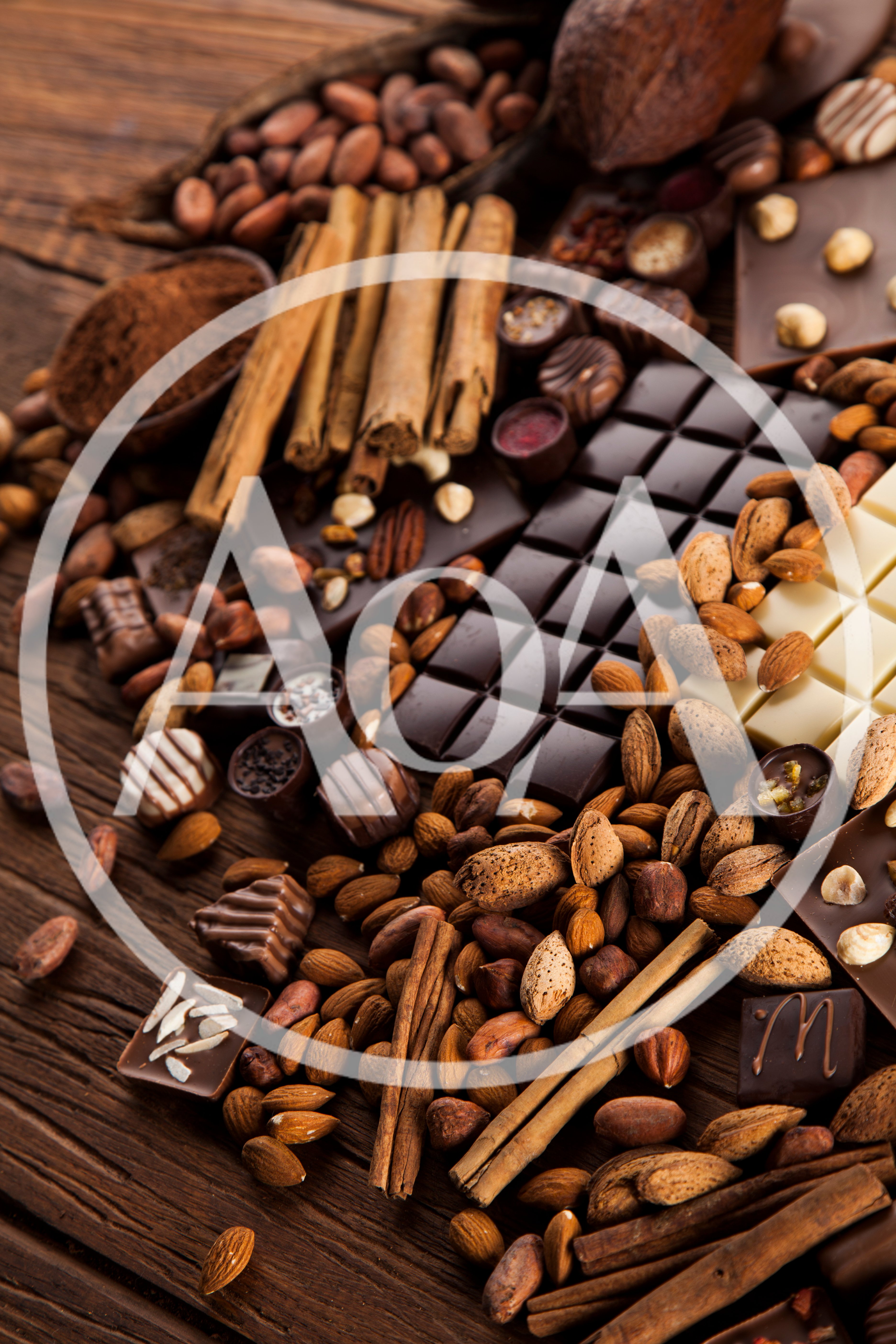 Assorted Chocolate Bars With Nuts And Cinnamon Sticks