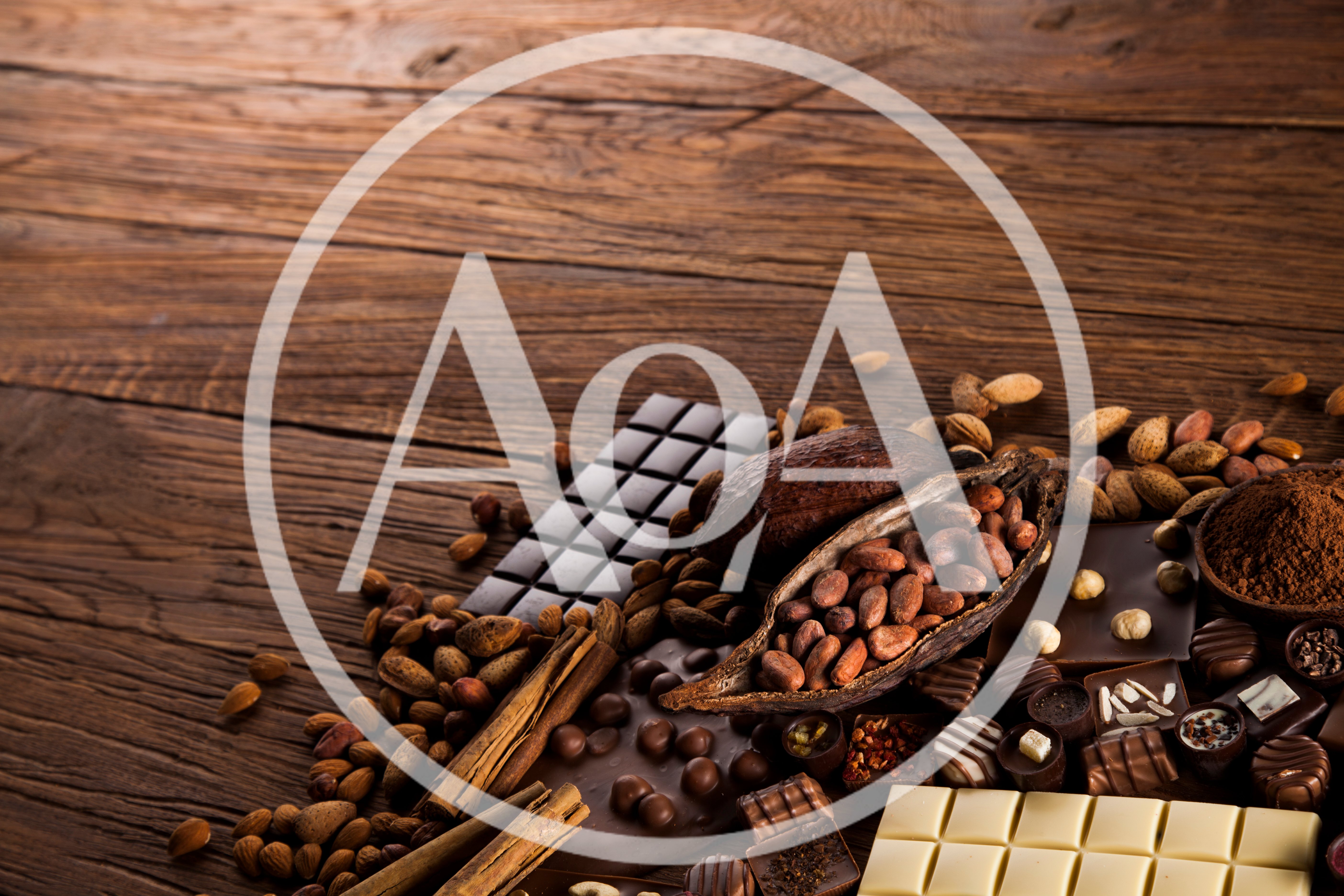 Assorted Chocolate Bars and Cocoa Beans on Wooden Table