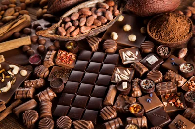 Assorted Gourmet Chocolates and Cocoa Beans