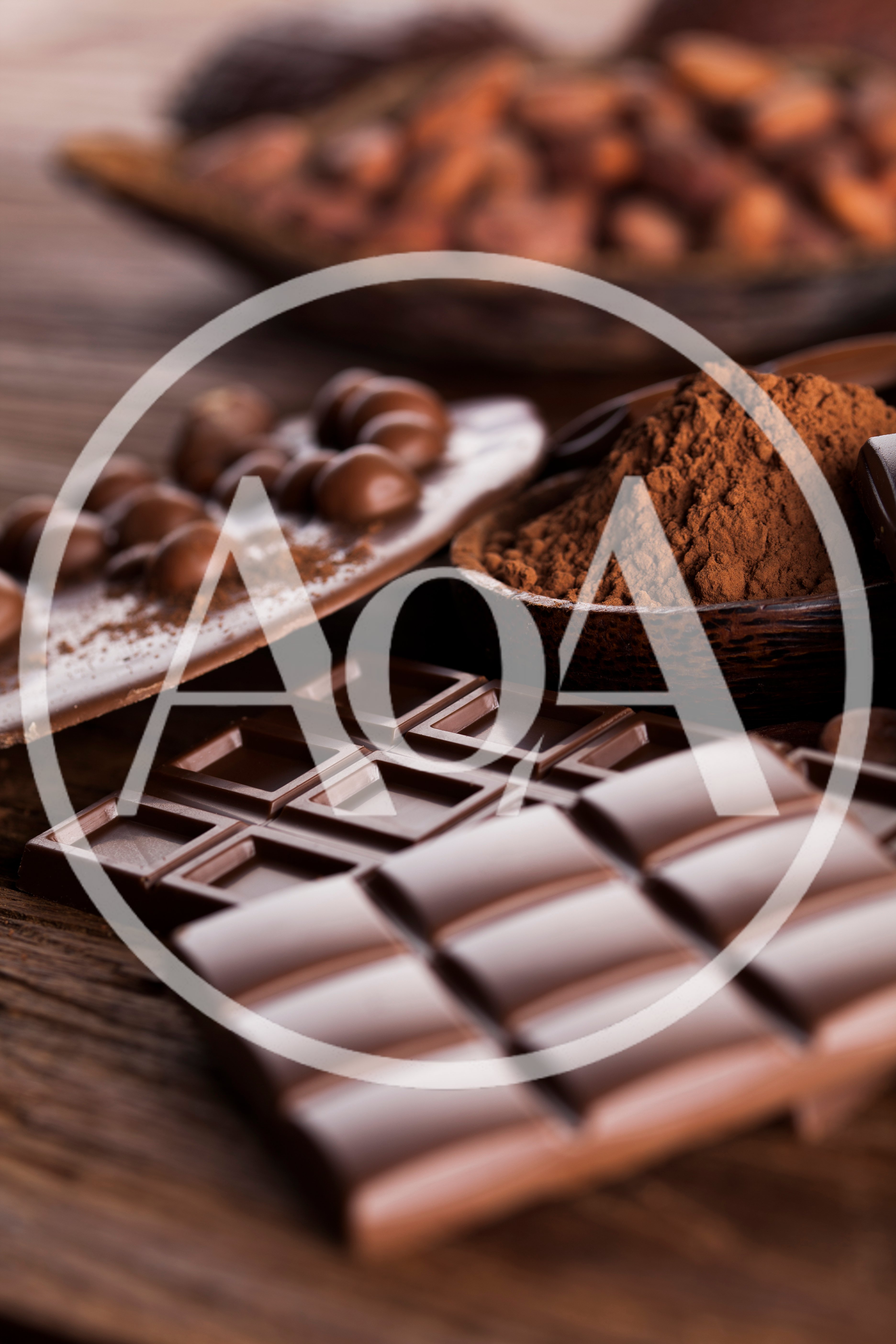 Assorted Chocolate Bars and Cocoa Powder on Wooden Table
