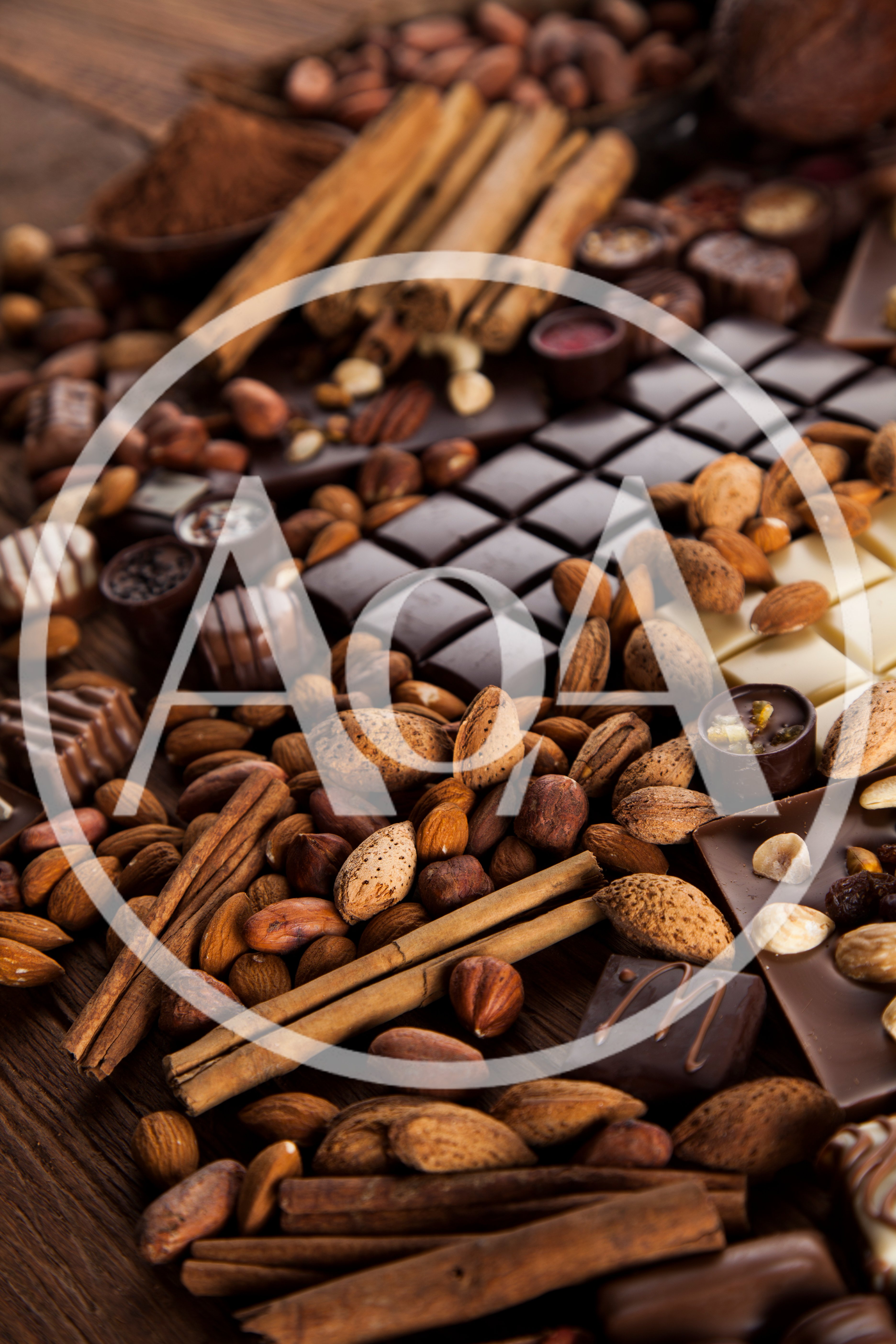Assorted Chocolate Bars With Nuts And Cinnamon Sticks