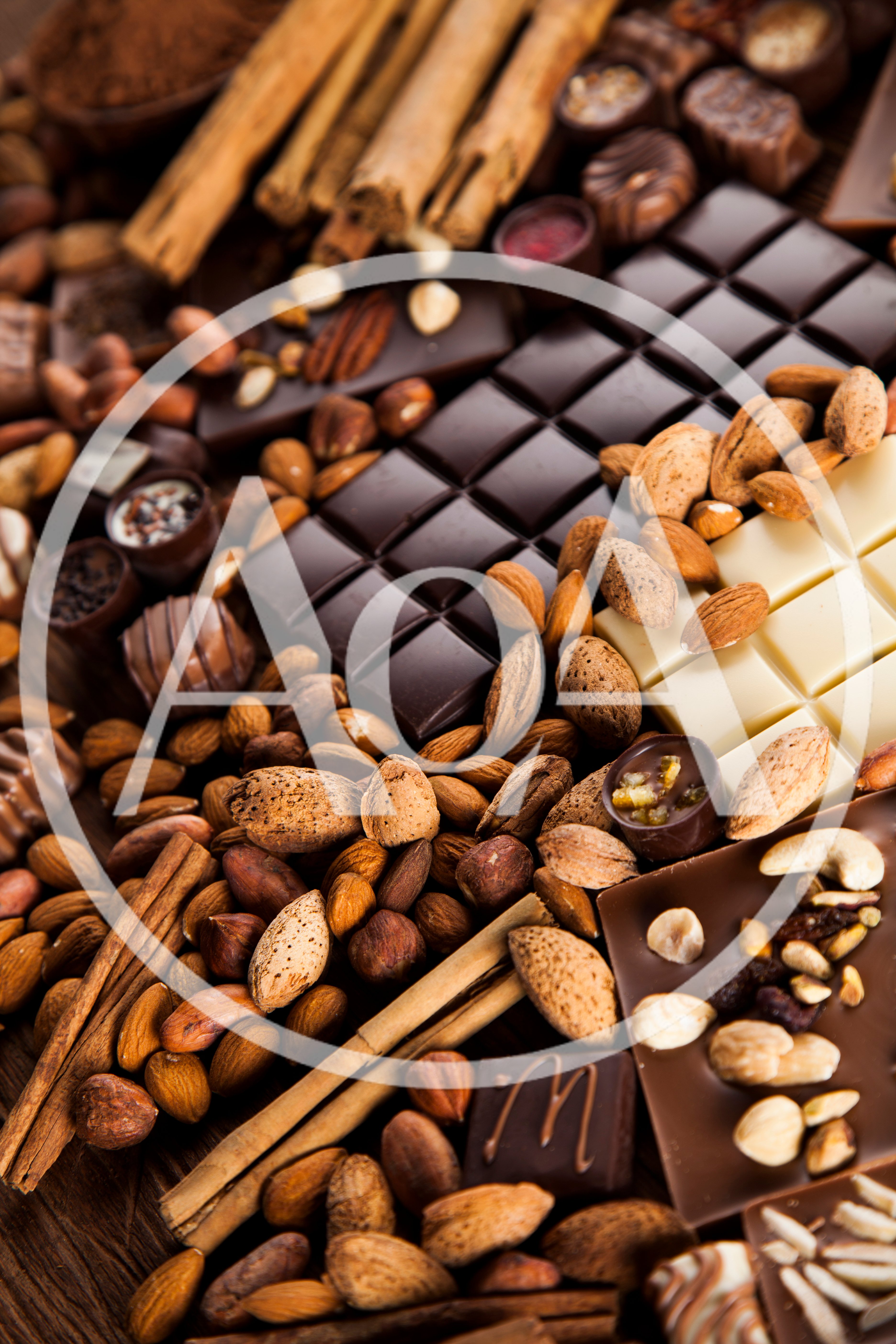 Assorted Chocolate Bars With Nuts And Cinnamon Sticks