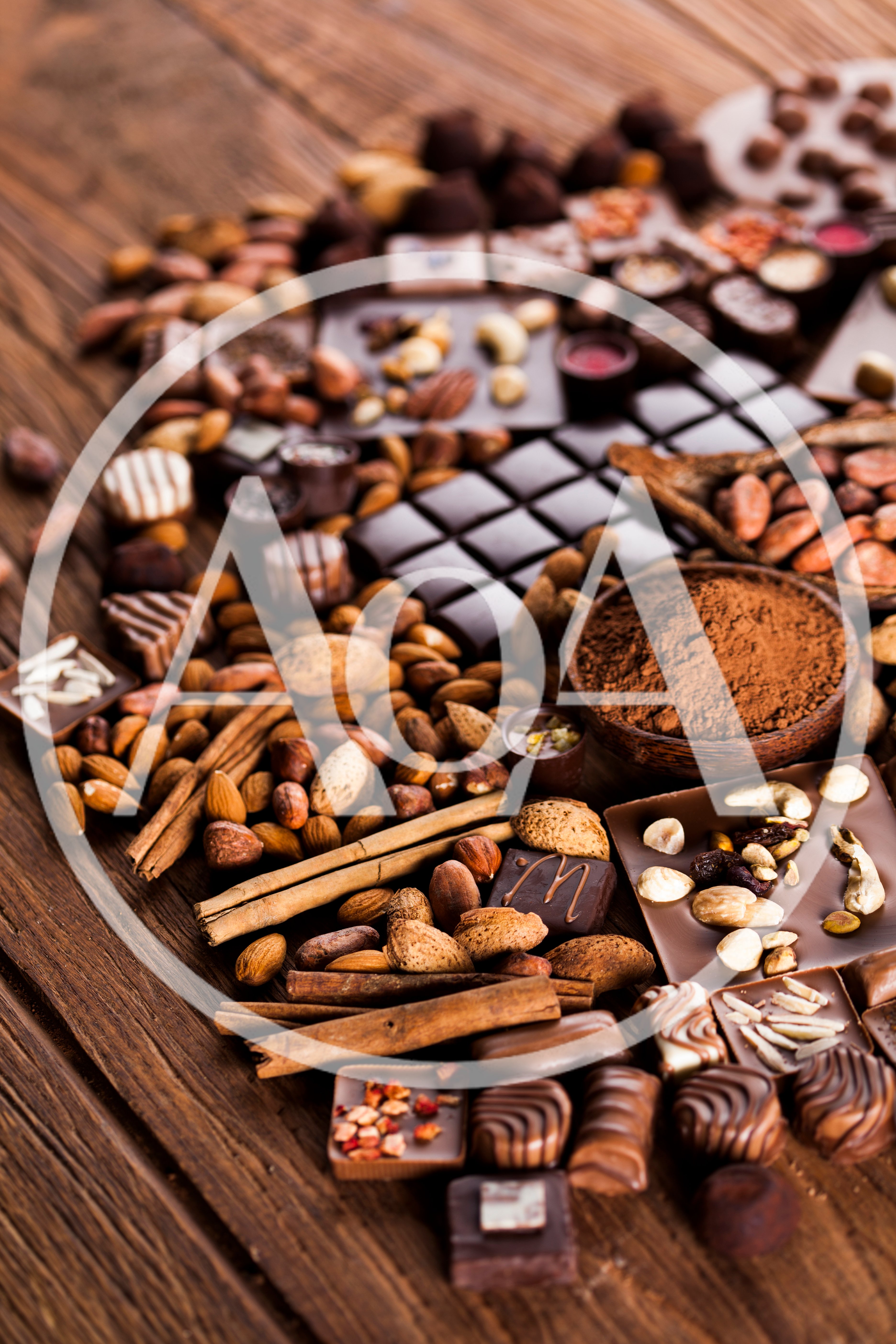 Assorted Chocolates and Nuts on Rustic Wooden Table