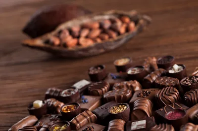 Assorted Gourmet Chocolate Pralines on Wooden Table