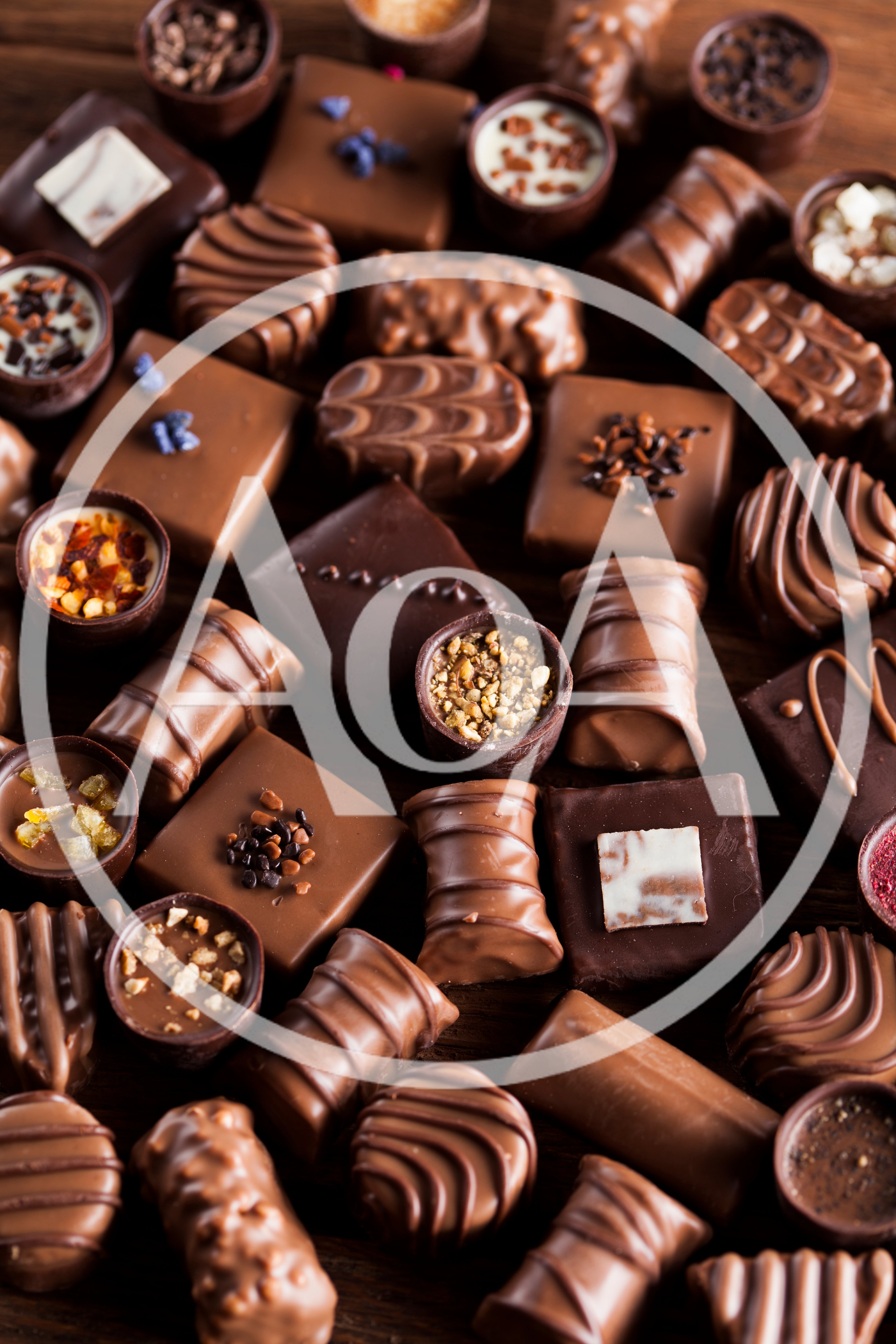 Assorted Gourmet Chocolate Truffles on Wooden Background