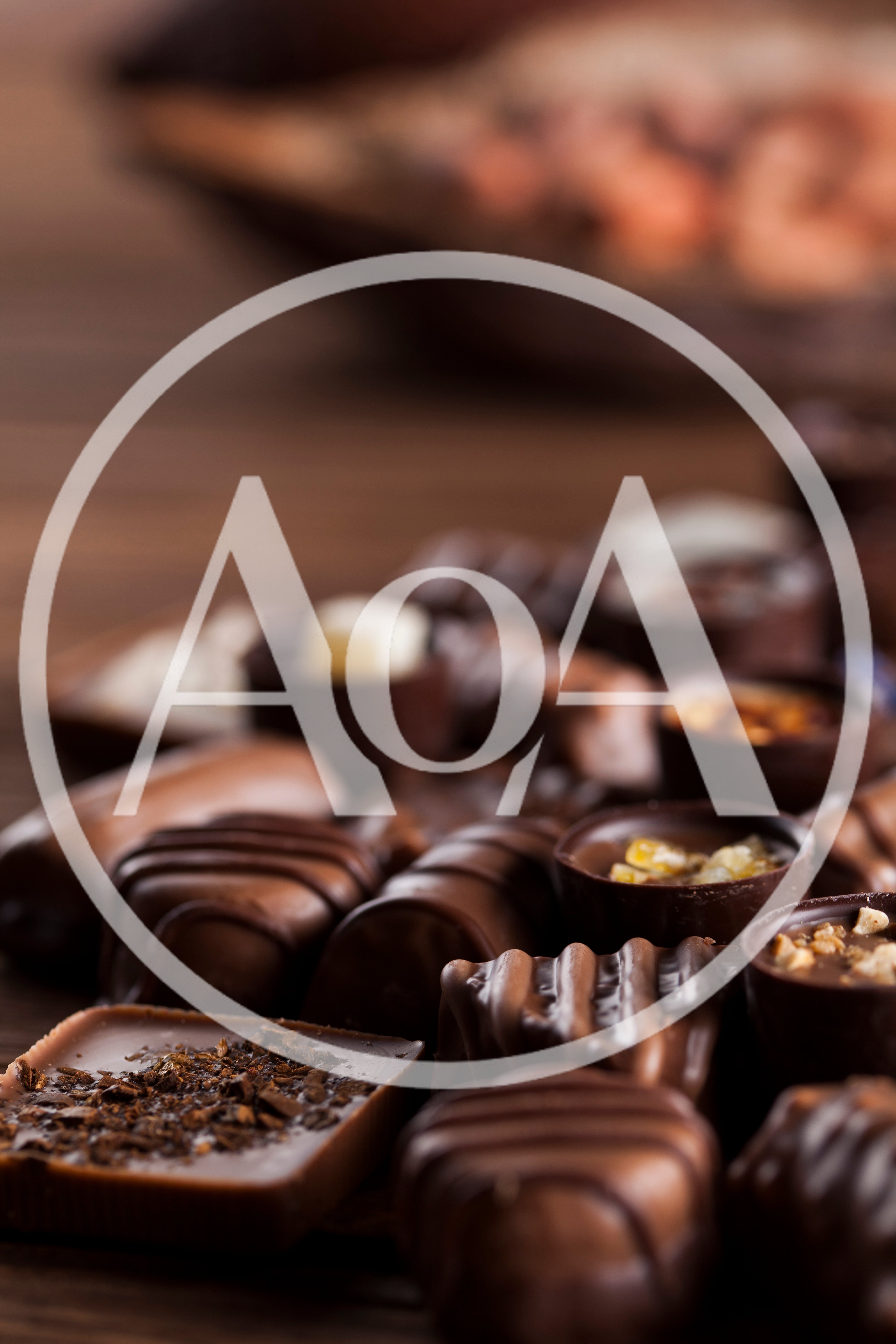 Assorted Gourmet Chocolate Pralines On Wooden Table