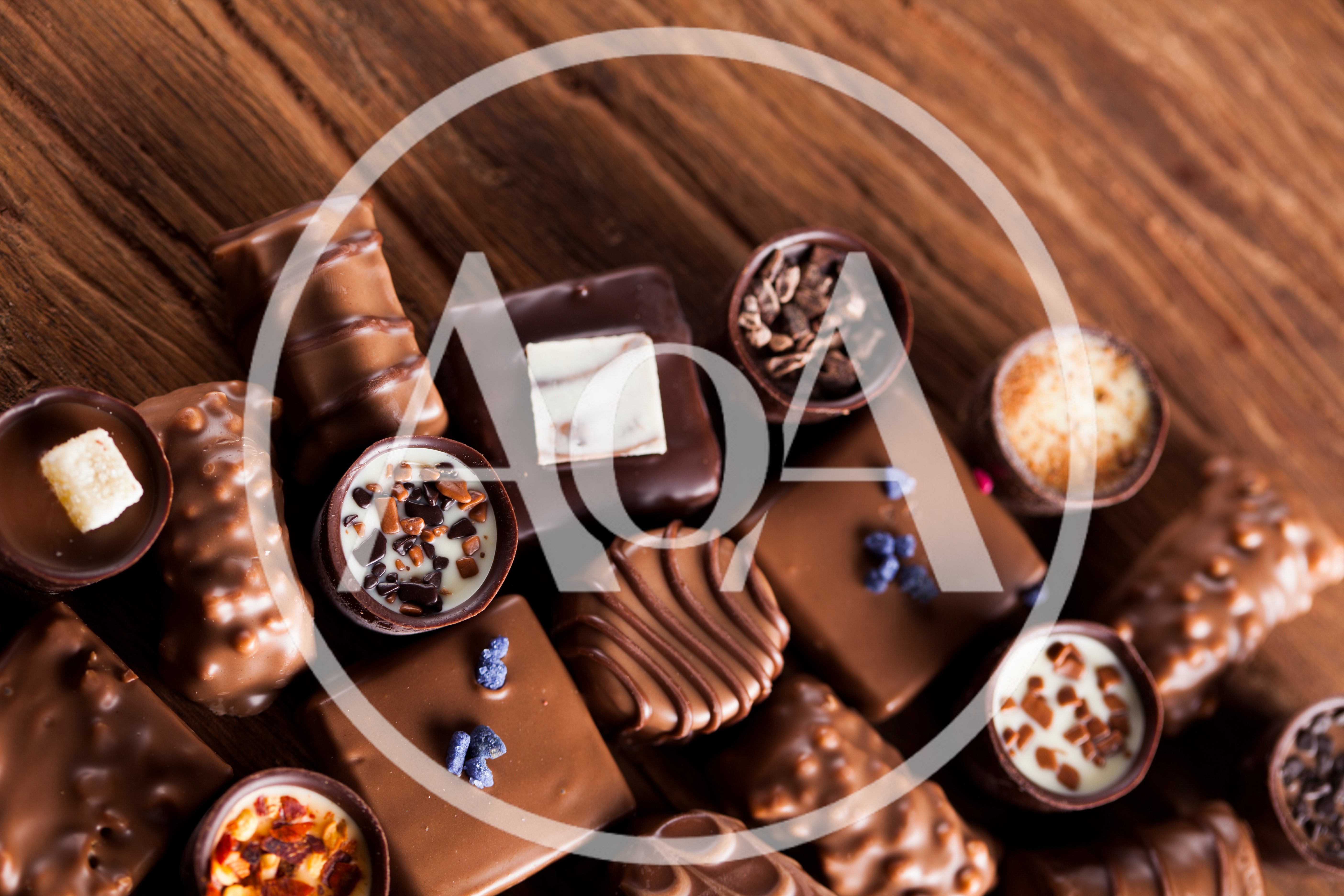 Assorted Gourmet Chocolate Truffles on Wooden Background