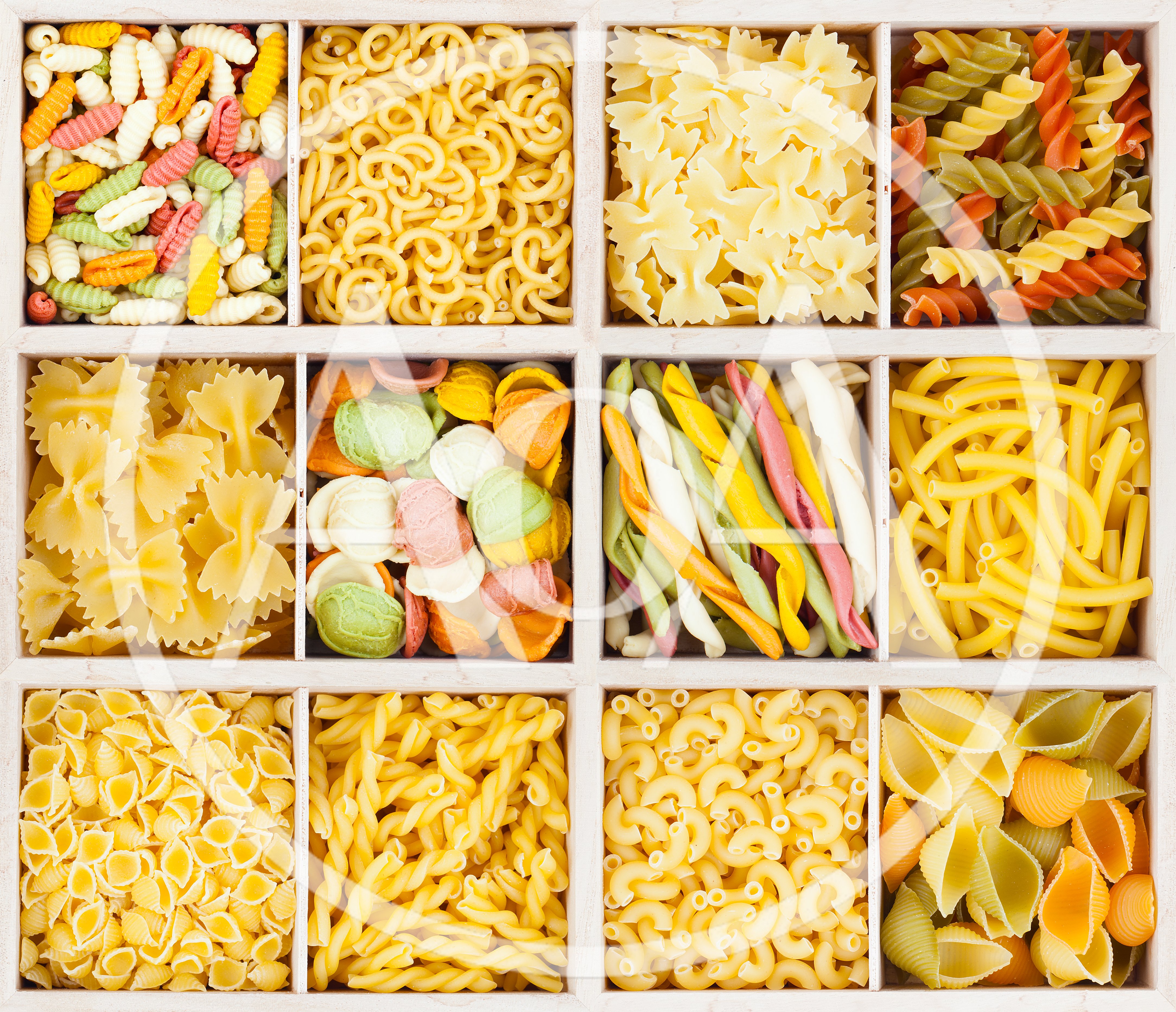 Assorted Varieties Of Dry Pasta In A Grid Box