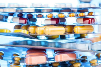 Stack of Pharmaceutical Blister Packs with Various Pills