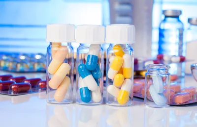Assorted Pharmaceutical Capsules and Tablets in Glass Vials